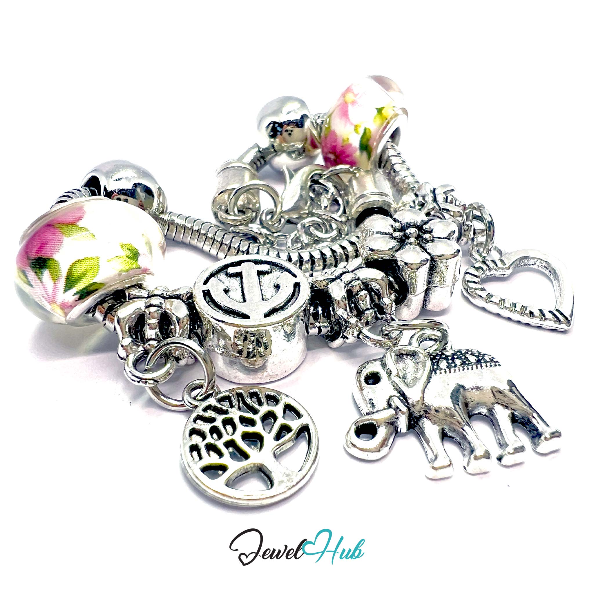 Silver charm bracelet with various charms on a white background, branded 'Jewel Hub'.