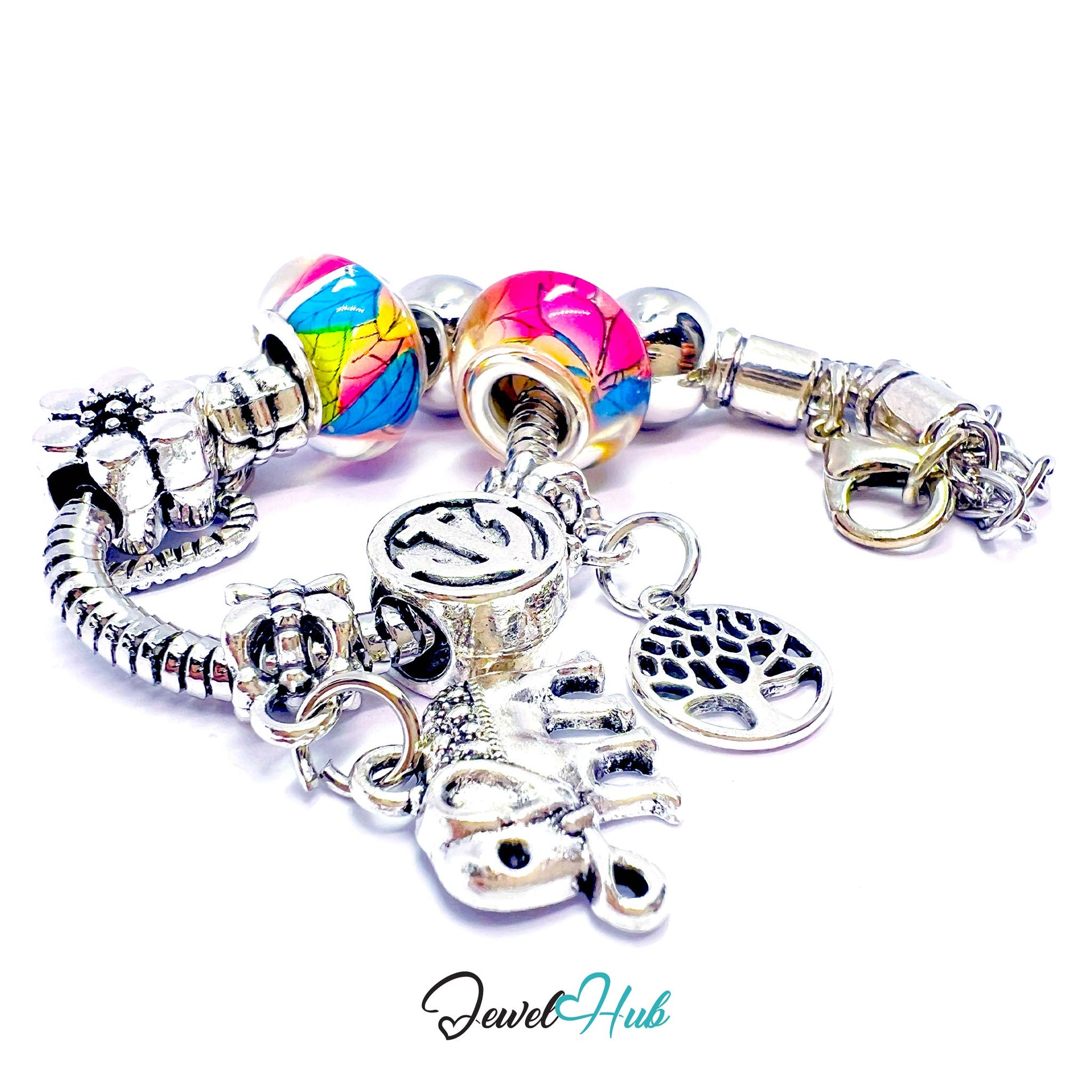 Charms bracelet with colorful beads and silver charms on a white background, branded 'Jewel Hub'.