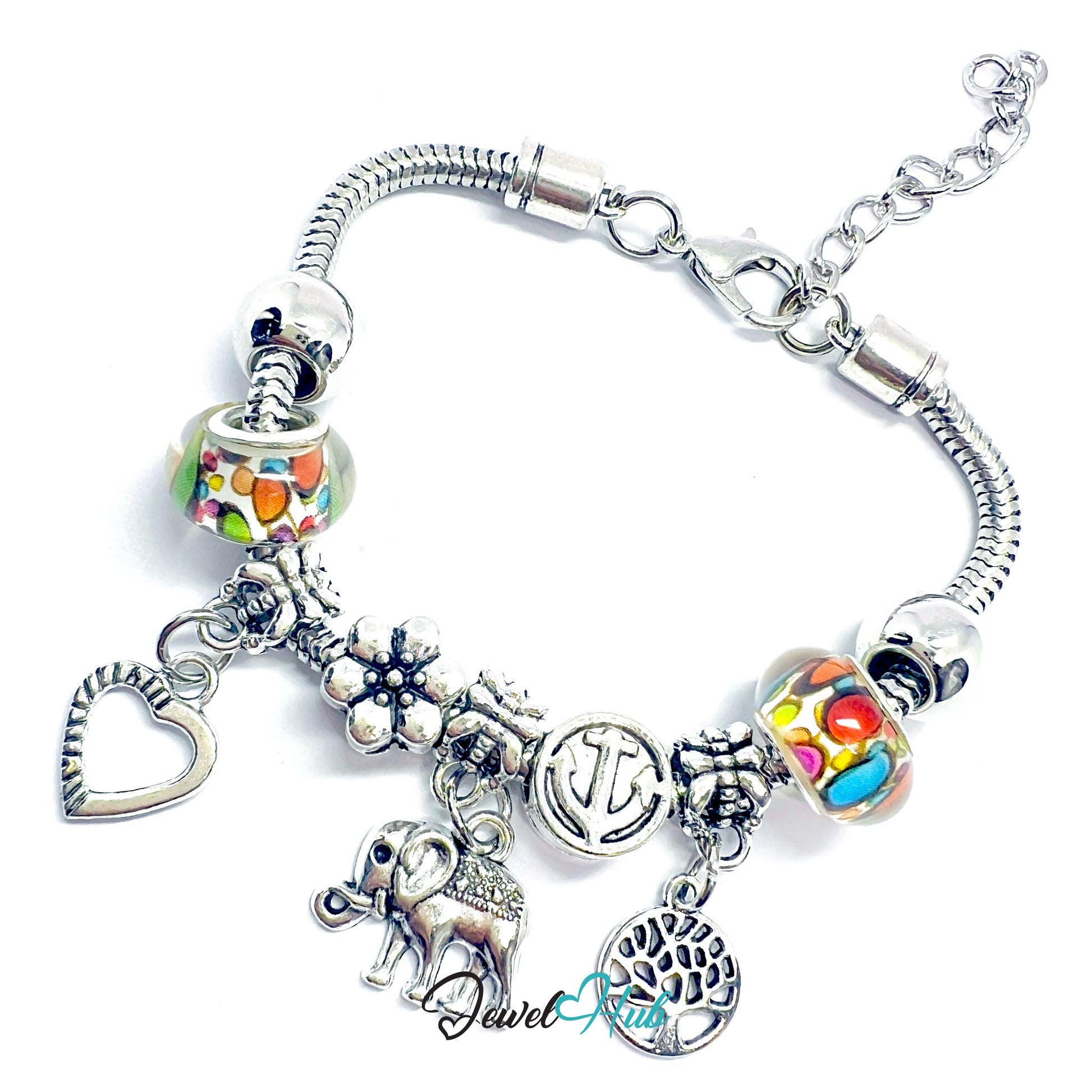 Silver bracelet with various charms on a white background