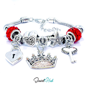 Silver charm bracelet with red beads and various charms on a white background, branded 'Jewel Hub'.