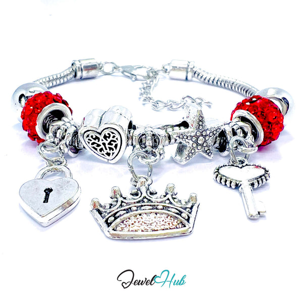 Silver charm bracelet with red beads and various charms on a white background, branded 'Jewel Hub'.