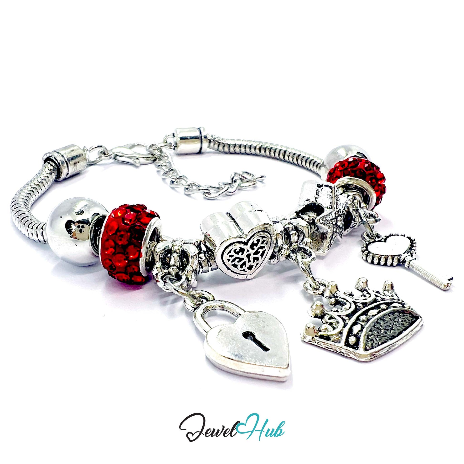 Silver bracelet with red beads and various charms on a white background, branded 'Jewel Hub'.