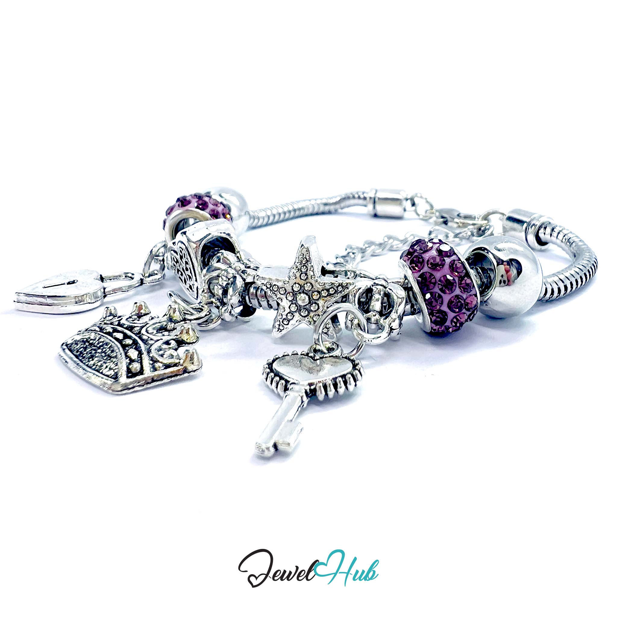 Silver bracelet with various charms including purple beads and a starfish on a white background.