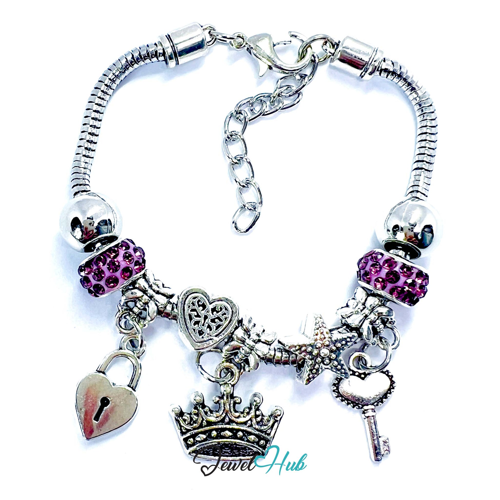 Silver charm bracelet with various charms including a heart, lock, and key on a white background.