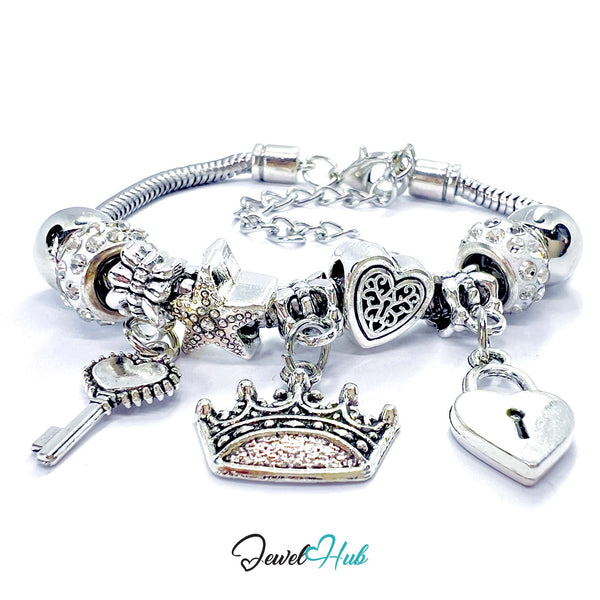 Silver charm bracelet with various charms on a white background, branded 'Jewel Hub'.