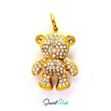 A gold teddy bear pendant encrusted with clear rhinestones, shown against a plain white background with a 'JewelHub' watermark at the bottom.