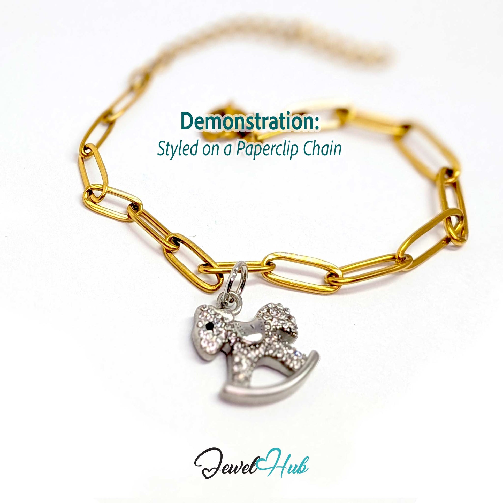 Silver rocking horse charm styled on a gold paperclip chain bracelet for a two-tone look - JewelHub