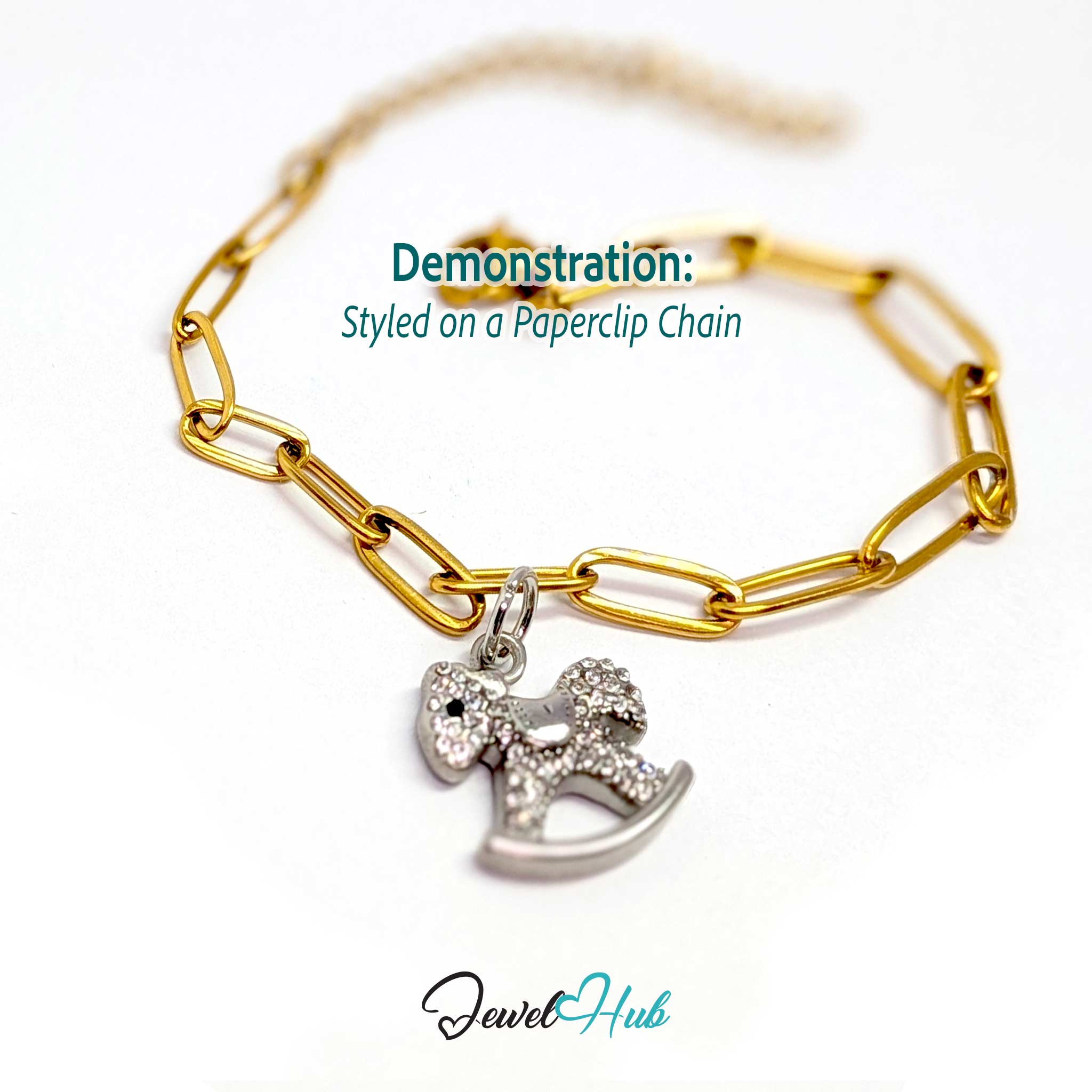Silver rocking horse charm styled on a gold paperclip chain bracelet for a two-tone look - JewelHub