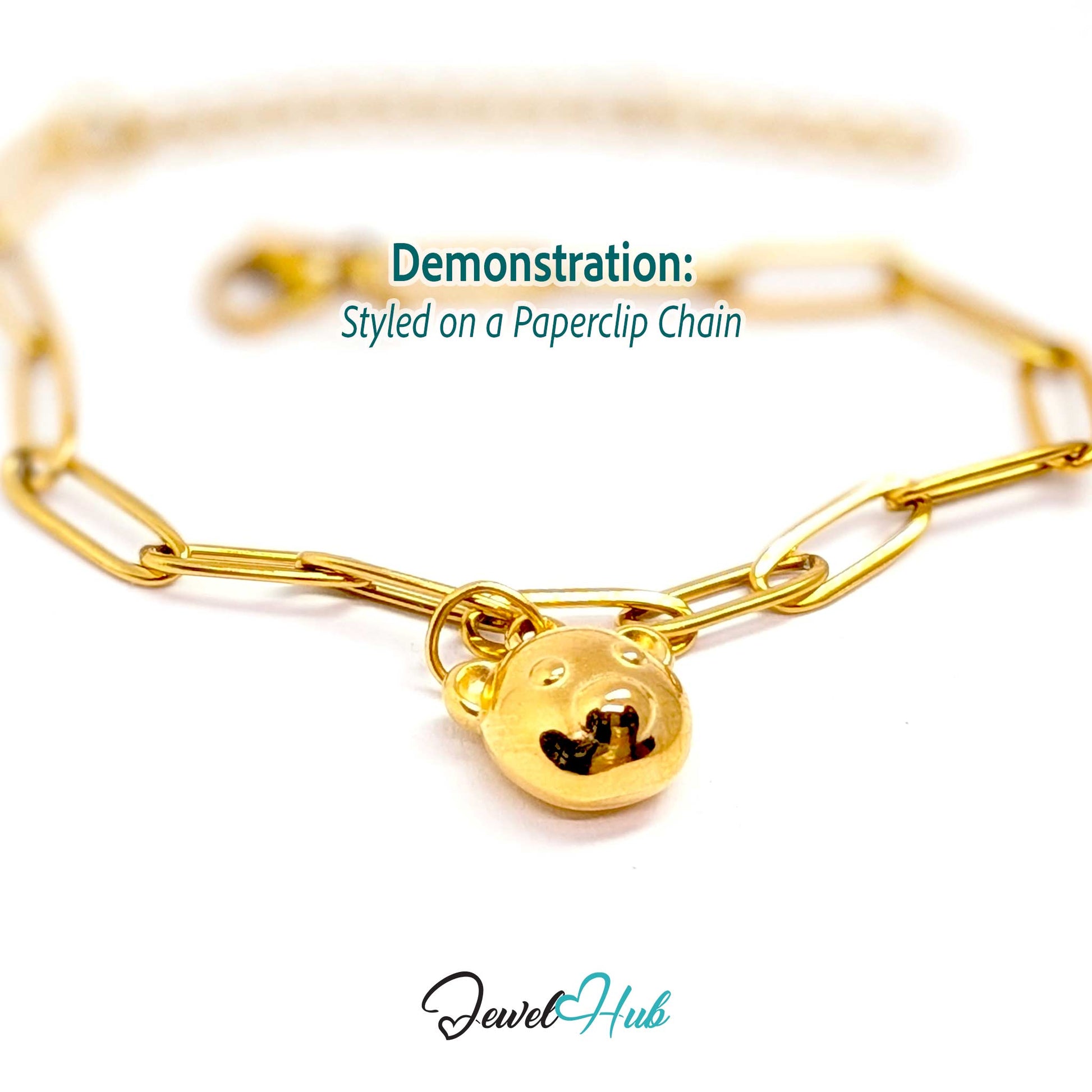 Gold bear head charm styled on a gold paperclip chain bracelet - JewelHub