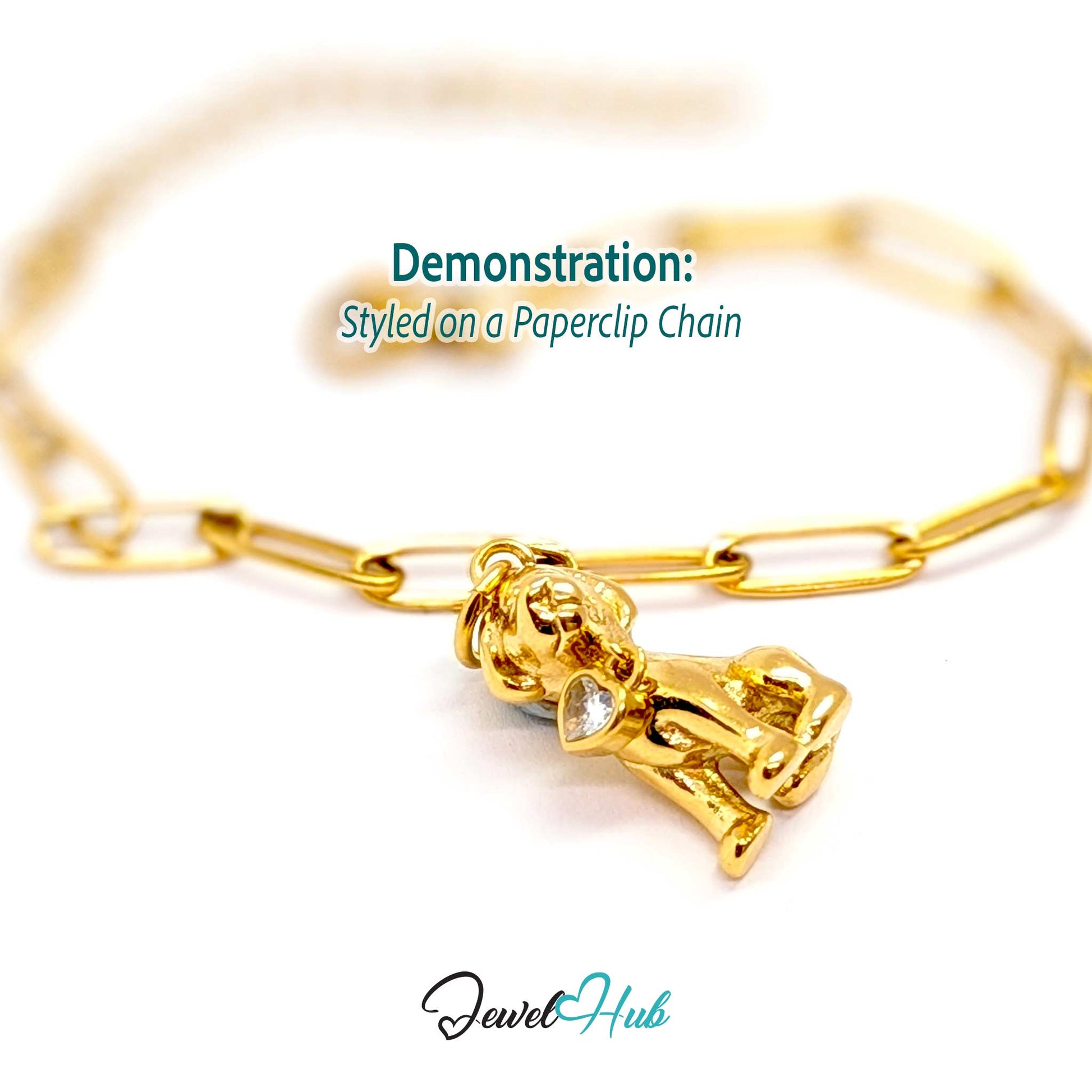 Gold sitting puppy charm styled on a gold paperclip chain bracelet - JewelHub