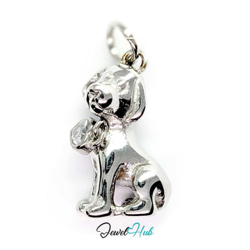 Crystal sitting puppy charm in silver stainless steel with a heart-shaped crystal collar tag - JewelHub
