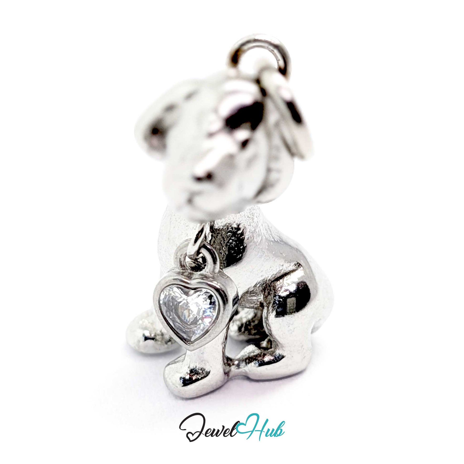 Silver sitting puppy charm from the front, showing the bezel-set heart crystal at its chest - JewelHub