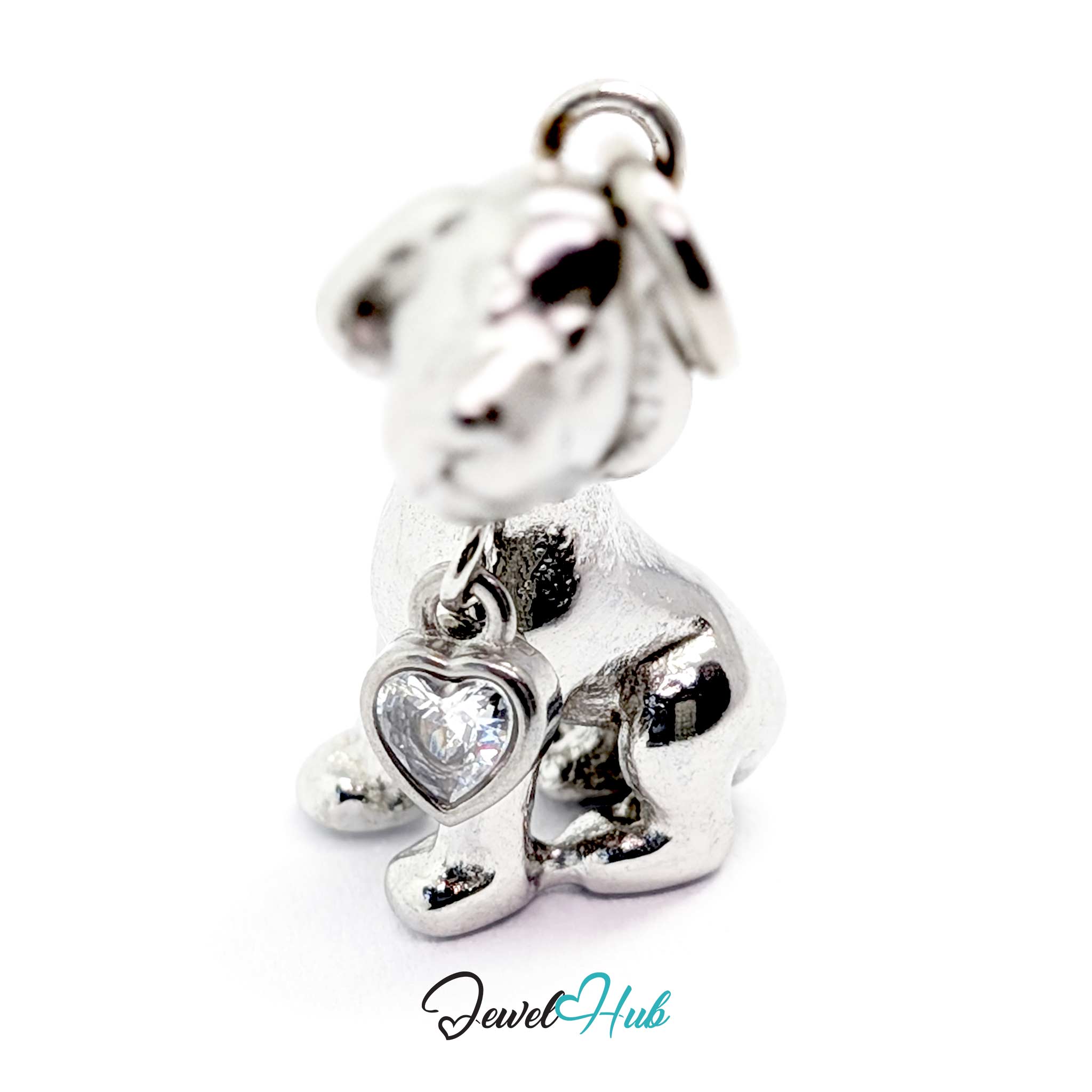 Silver sitting puppy charm from the front, showing the bezel-set heart crystal at its chest - JewelHub