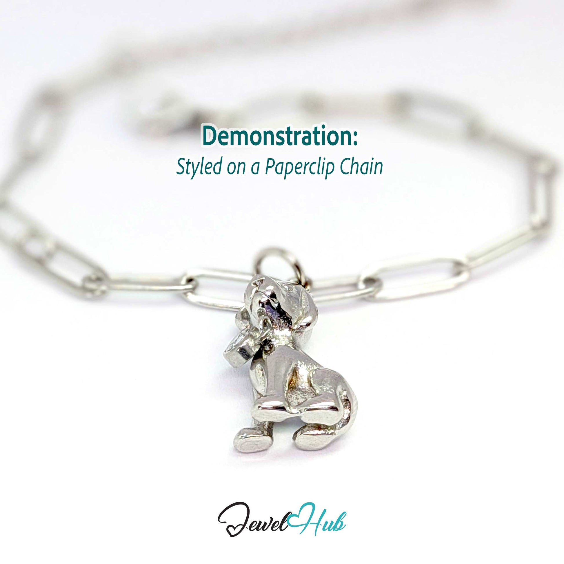 Silver sitting puppy charm styled on a silver paperclip chain bracelet - JewelHub