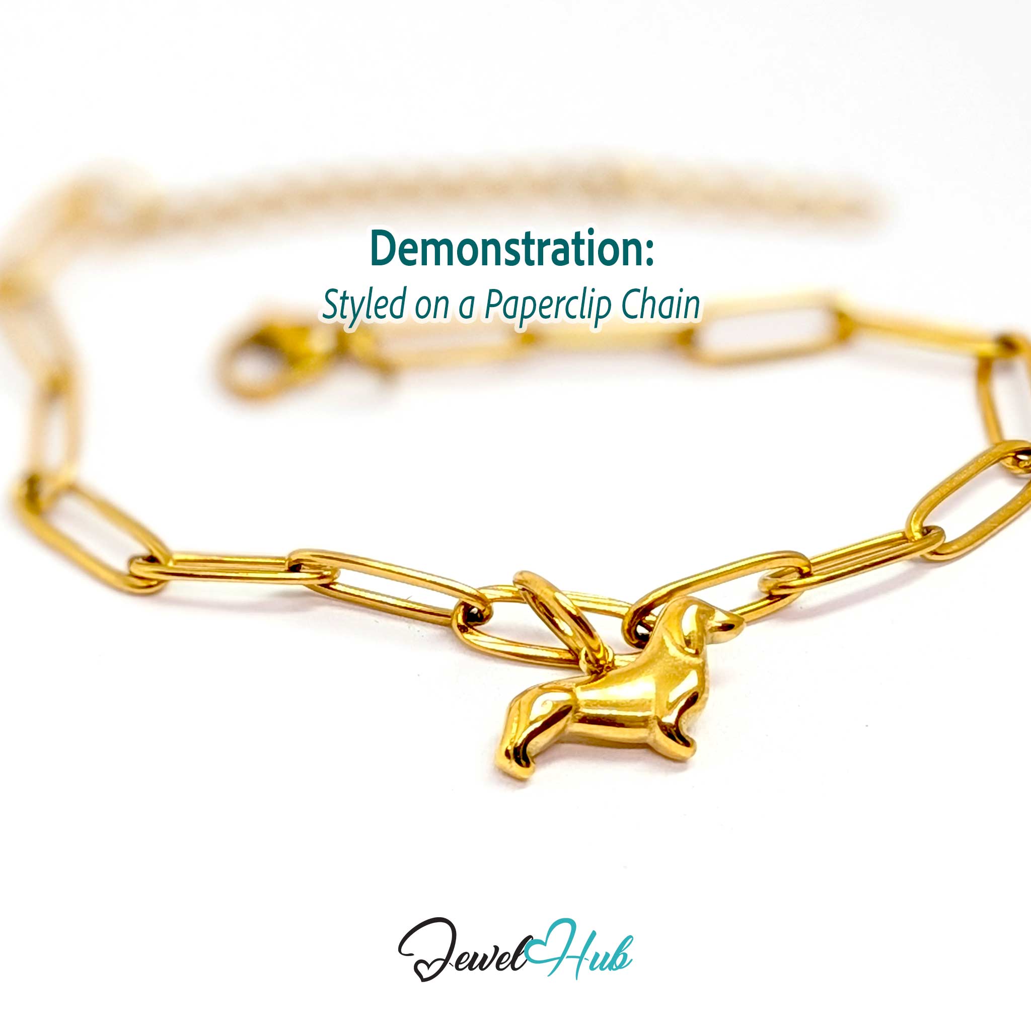 Gold dachshund charm styled on a gold paperclip chain bracelet - JewelHub