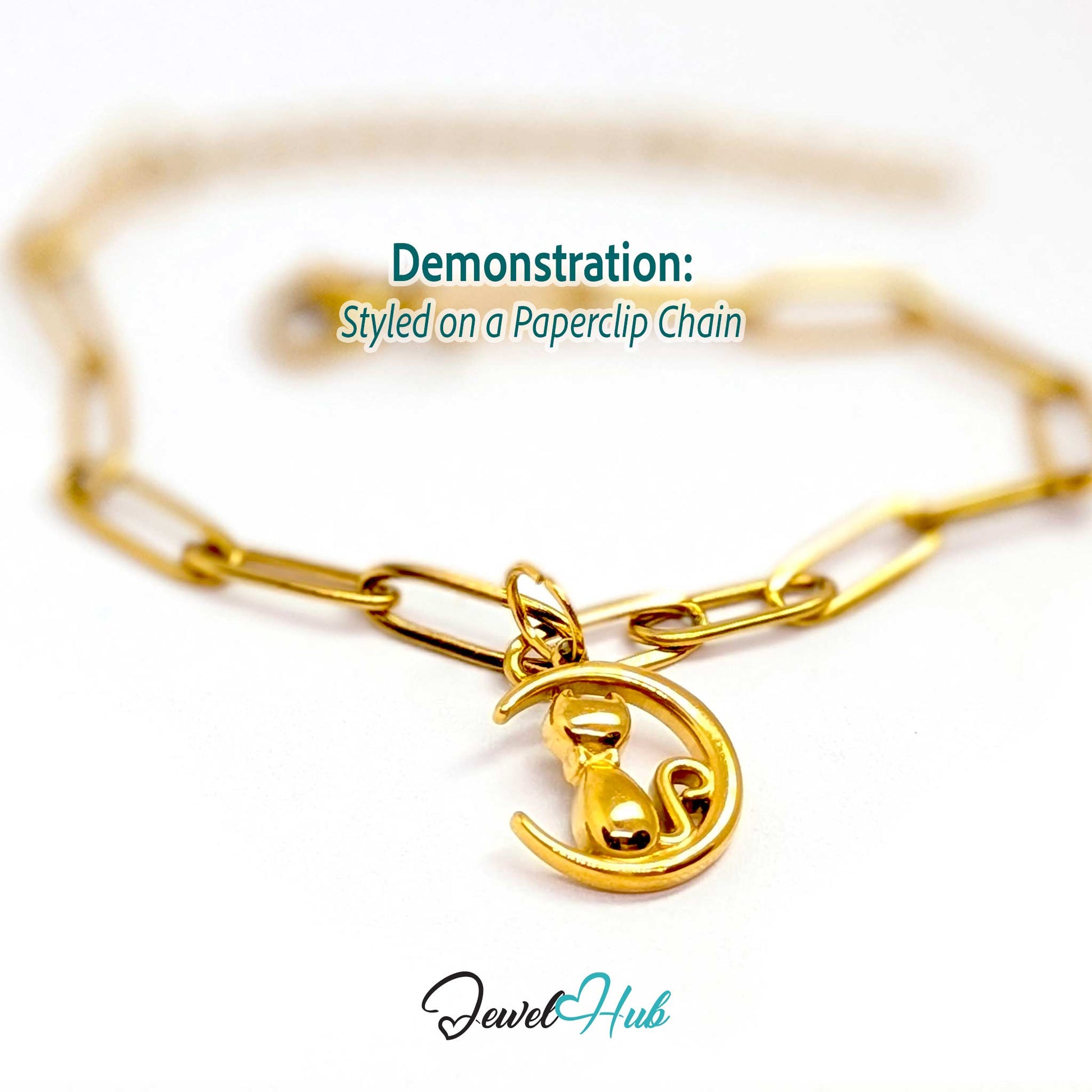 Gold cat and moon charm styled on a gold paperclip chain bracelet - JewelHub