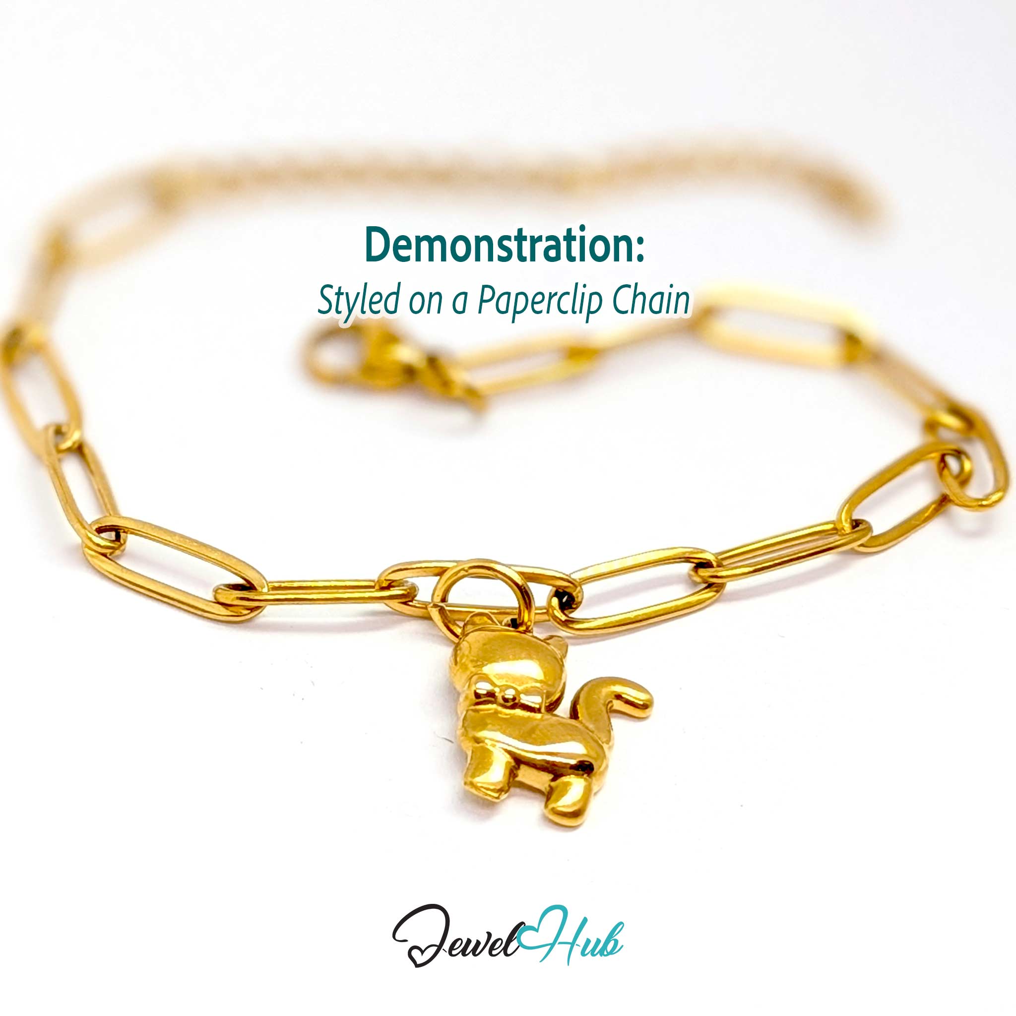 Gold cute cat charm styled on a gold paperclip chain bracelet - JewelHub