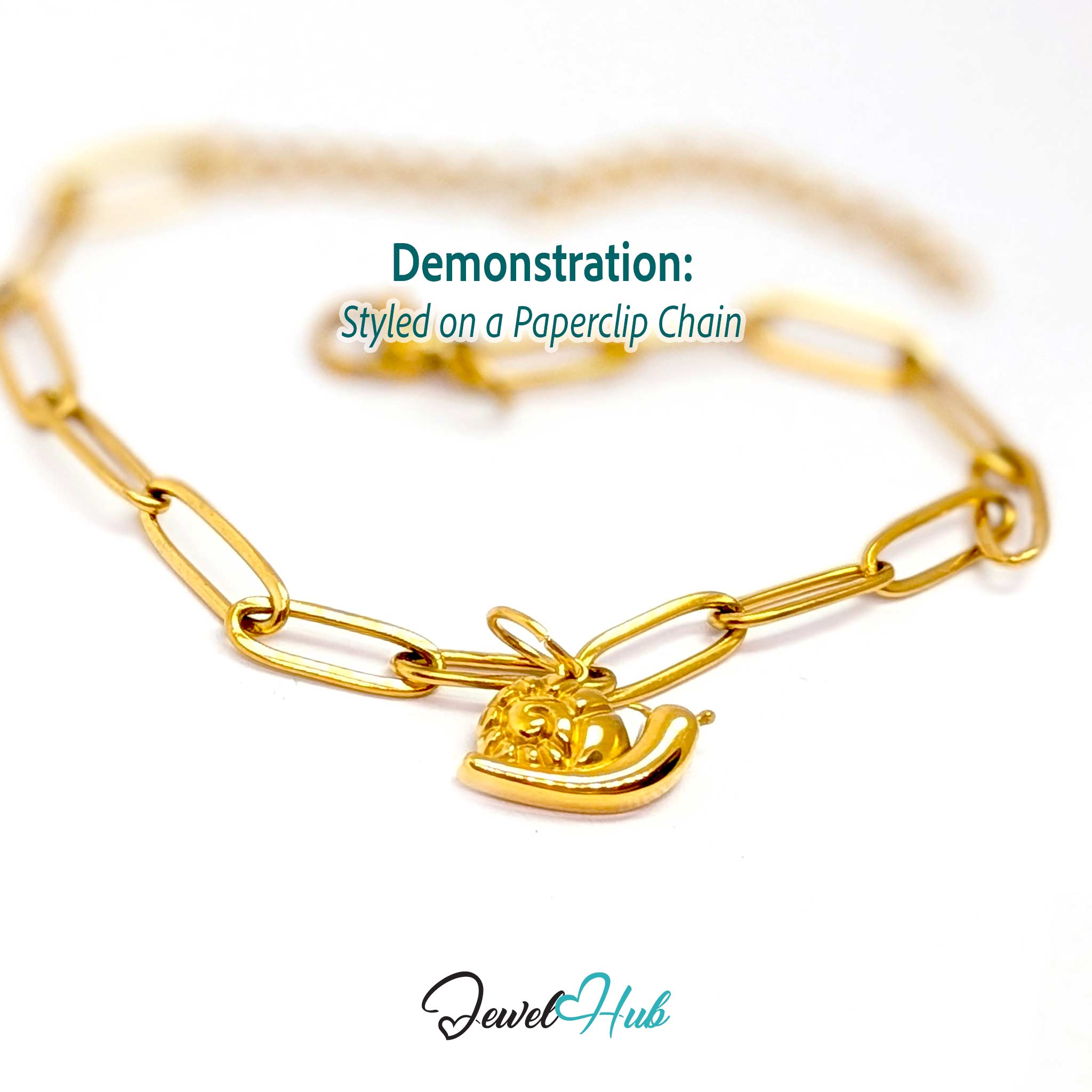 Gold snail charm styled on a gold paperclip chain bracelet - JewelHub