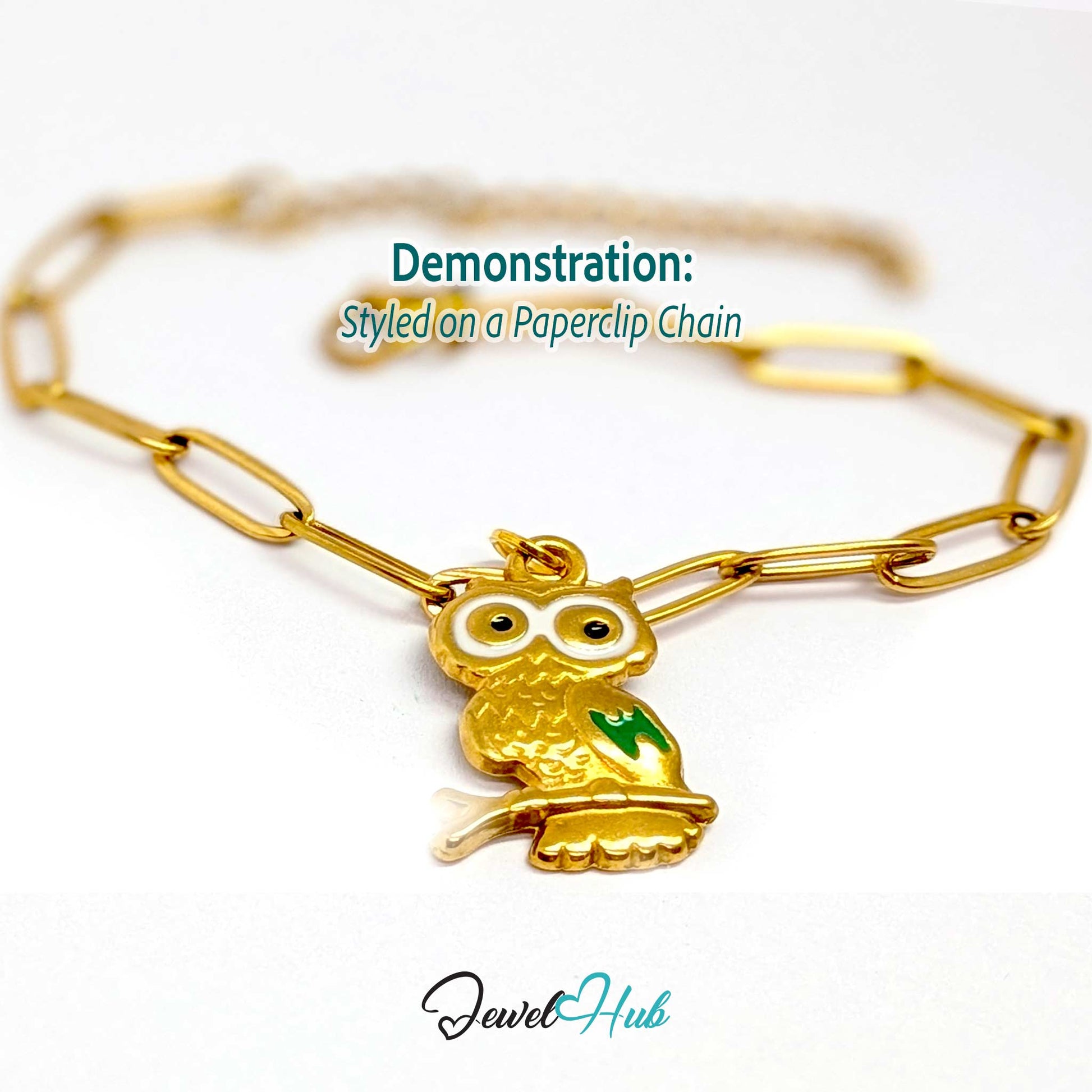 Gold enamel owl charm styled on a gold paperclip chain bracelet - JewelHub