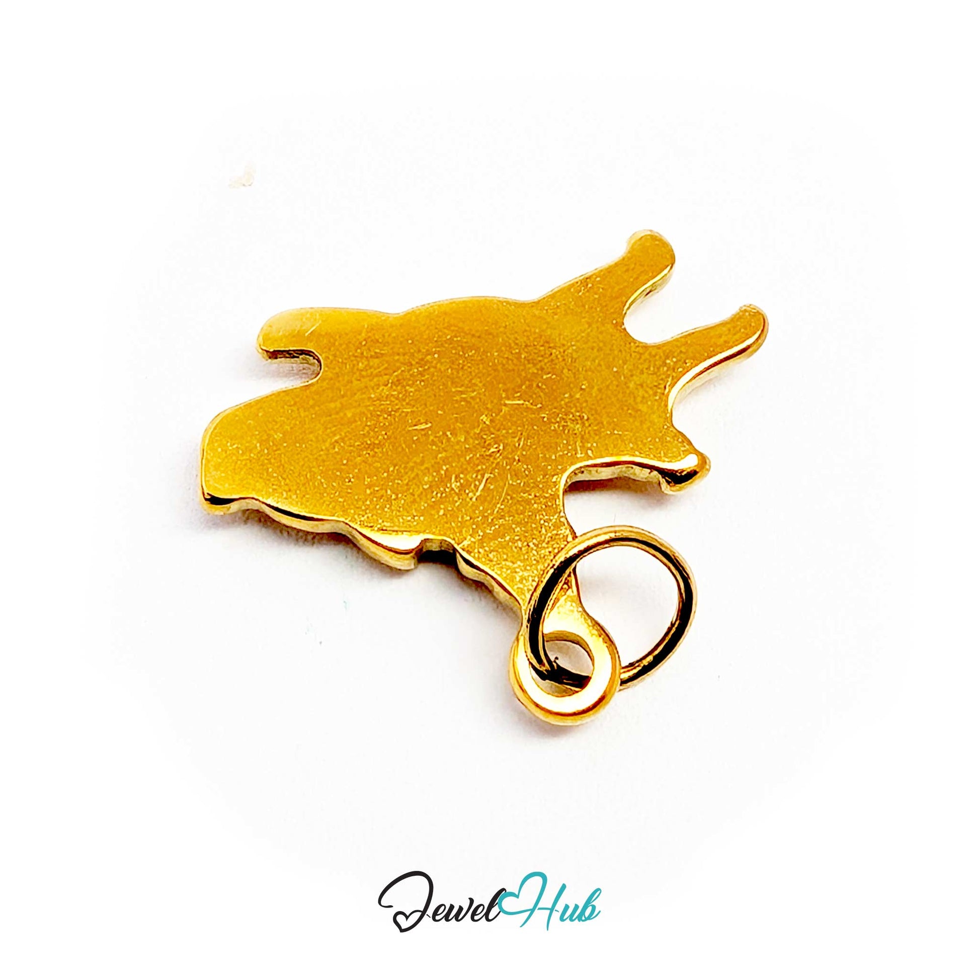 Gold flying pig charm laid flat to show its 2.5mm depth - JewelHub