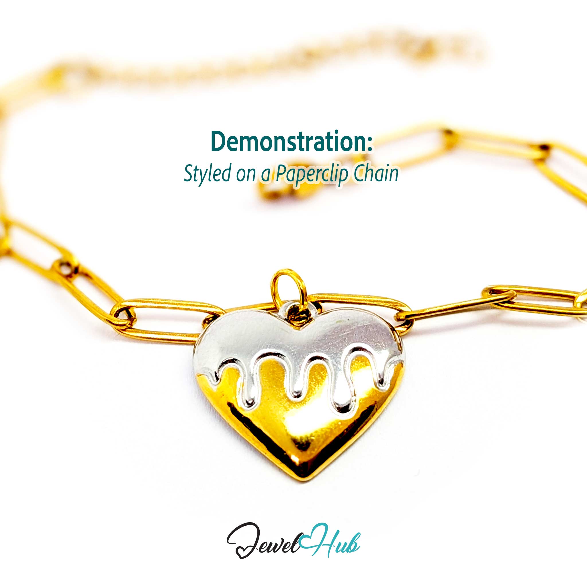 Drip Heart charm, two-tone stainless steel, styled on a gold paperclip chain bracelet - JewelHub