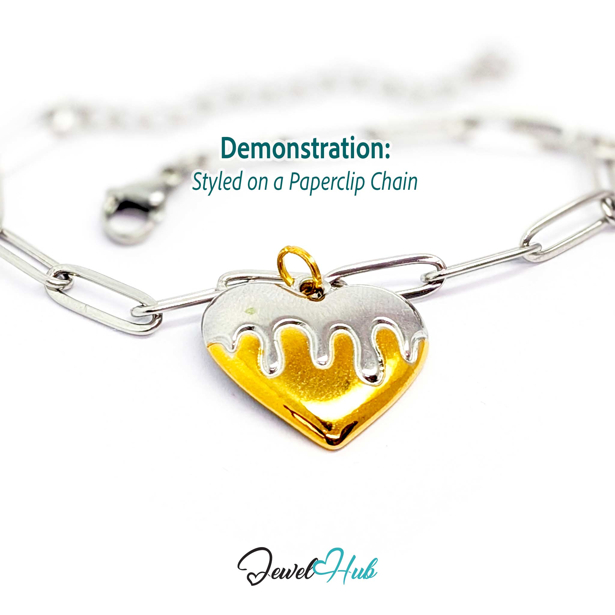 Drip Heart charm, two-tone stainless steel, styled on a silver paperclip chain bracelet - JewelHub