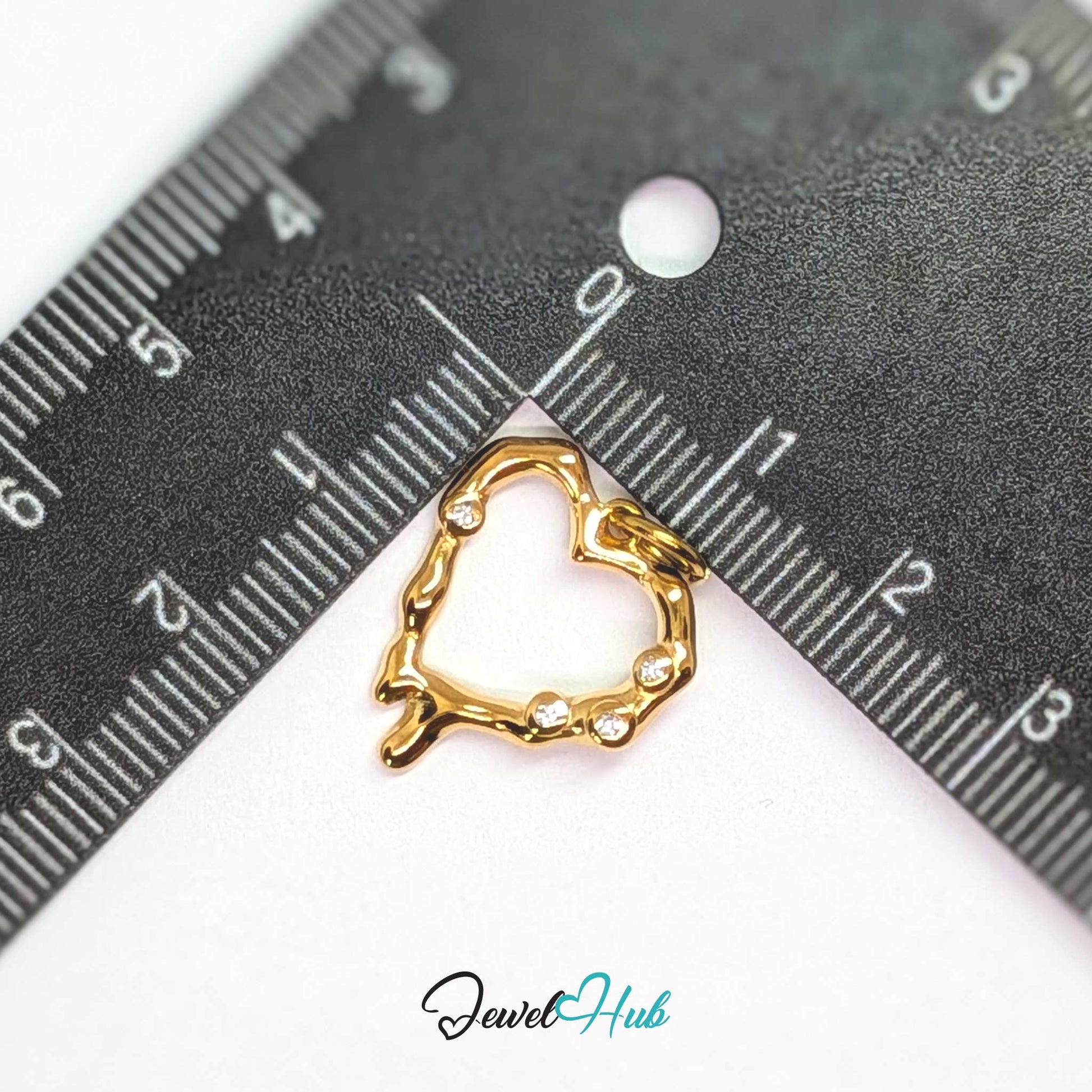 Outline Heart charm, gold stainless steel, measured against a ruler at 17.5 x 19mm - JewelHub