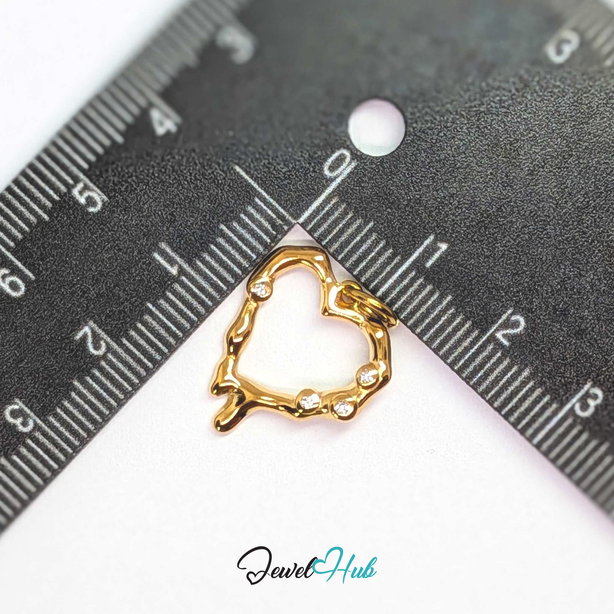 Outline Heart charm, gold stainless steel, measured against a ruler at 17.5 x 19mm - JewelHub