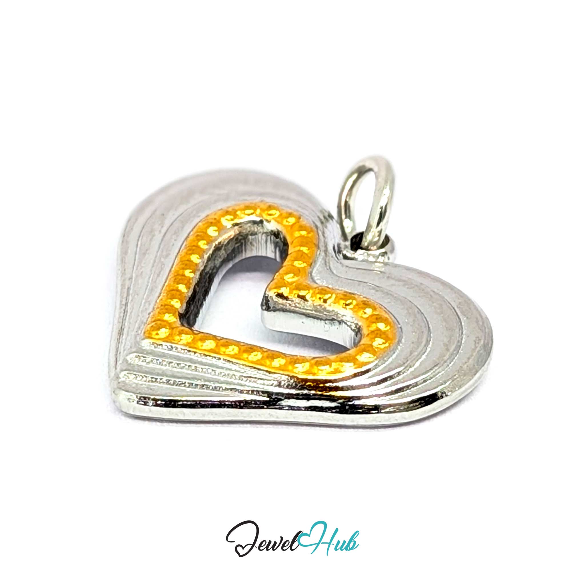 Hollow Heart charm at an angle, two-tone stainless steel - the stepped ridges and gold beading - JewelHub