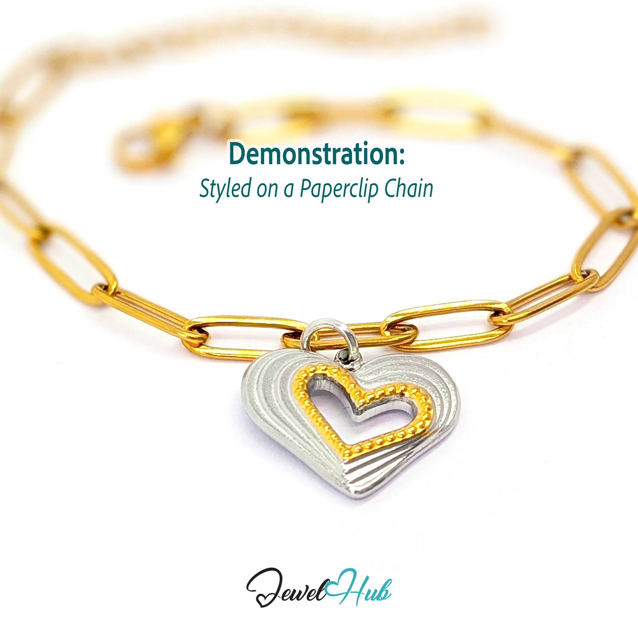 Hollow Heart charm, two-tone stainless steel, styled on a gold paperclip chain bracelet - JewelHub