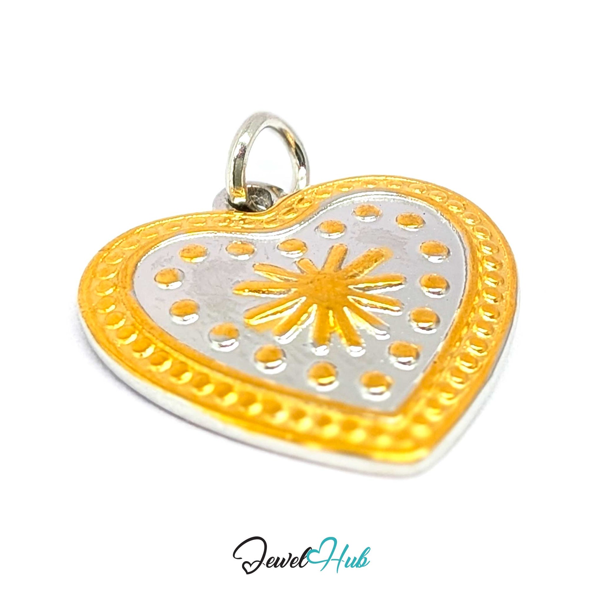 Starburst Heart charm at an angle, two-tone stainless steel - raised gold dots and rays on the silver - JewelHub