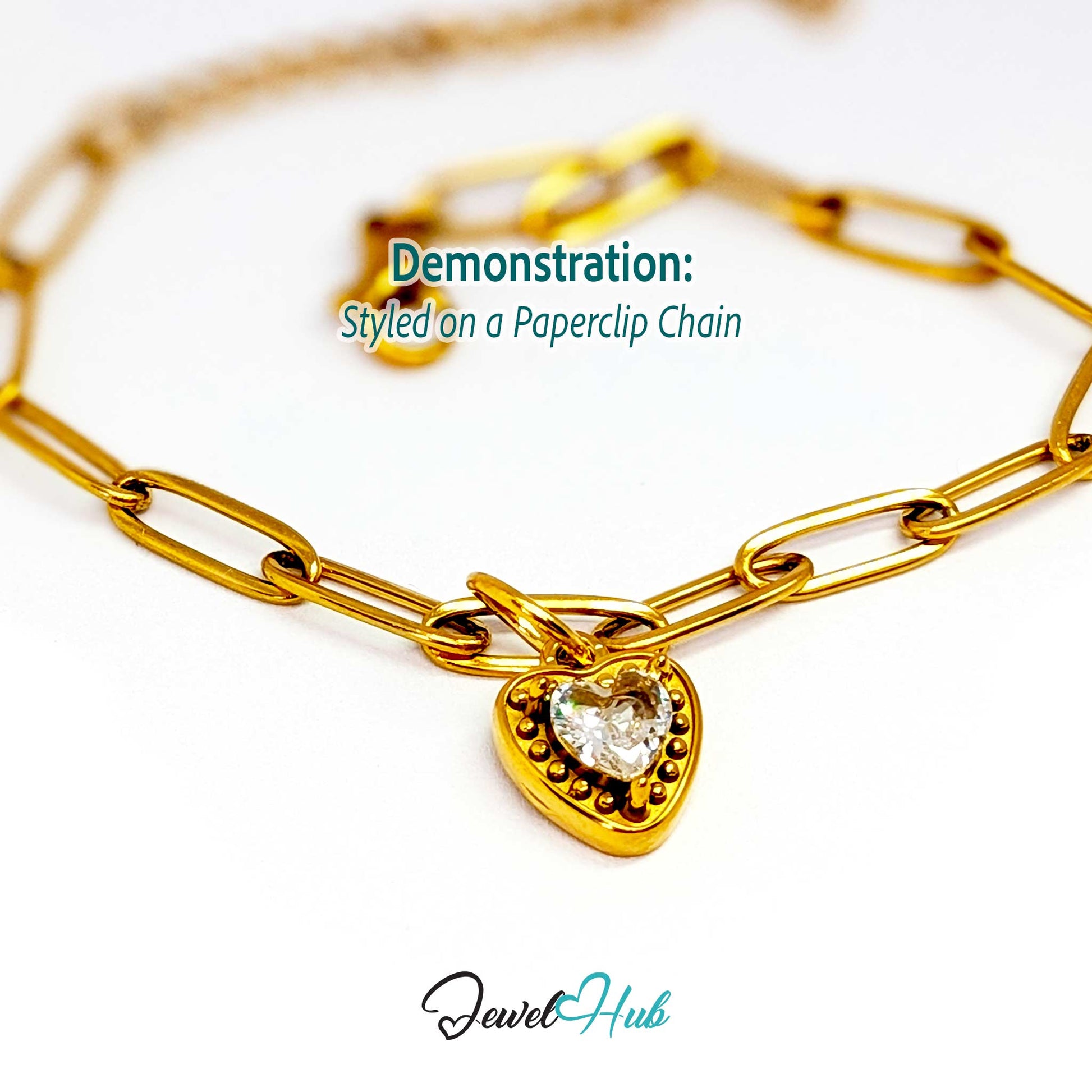 Gem Heart charm, gold stainless steel, styled on a gold paperclip chain bracelet - JewelHub