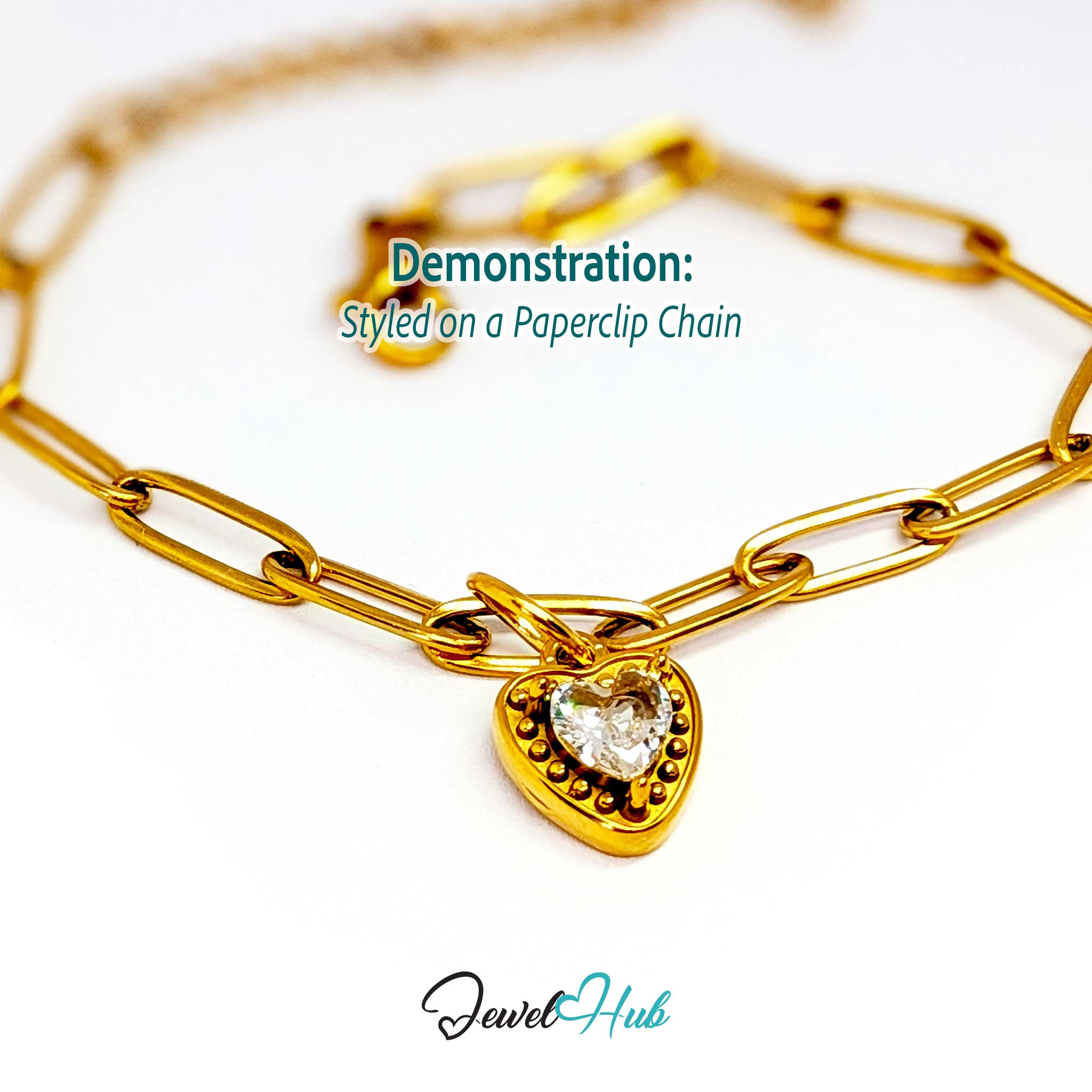 Gem Heart charm, gold stainless steel, styled on a gold paperclip chain bracelet - JewelHub
