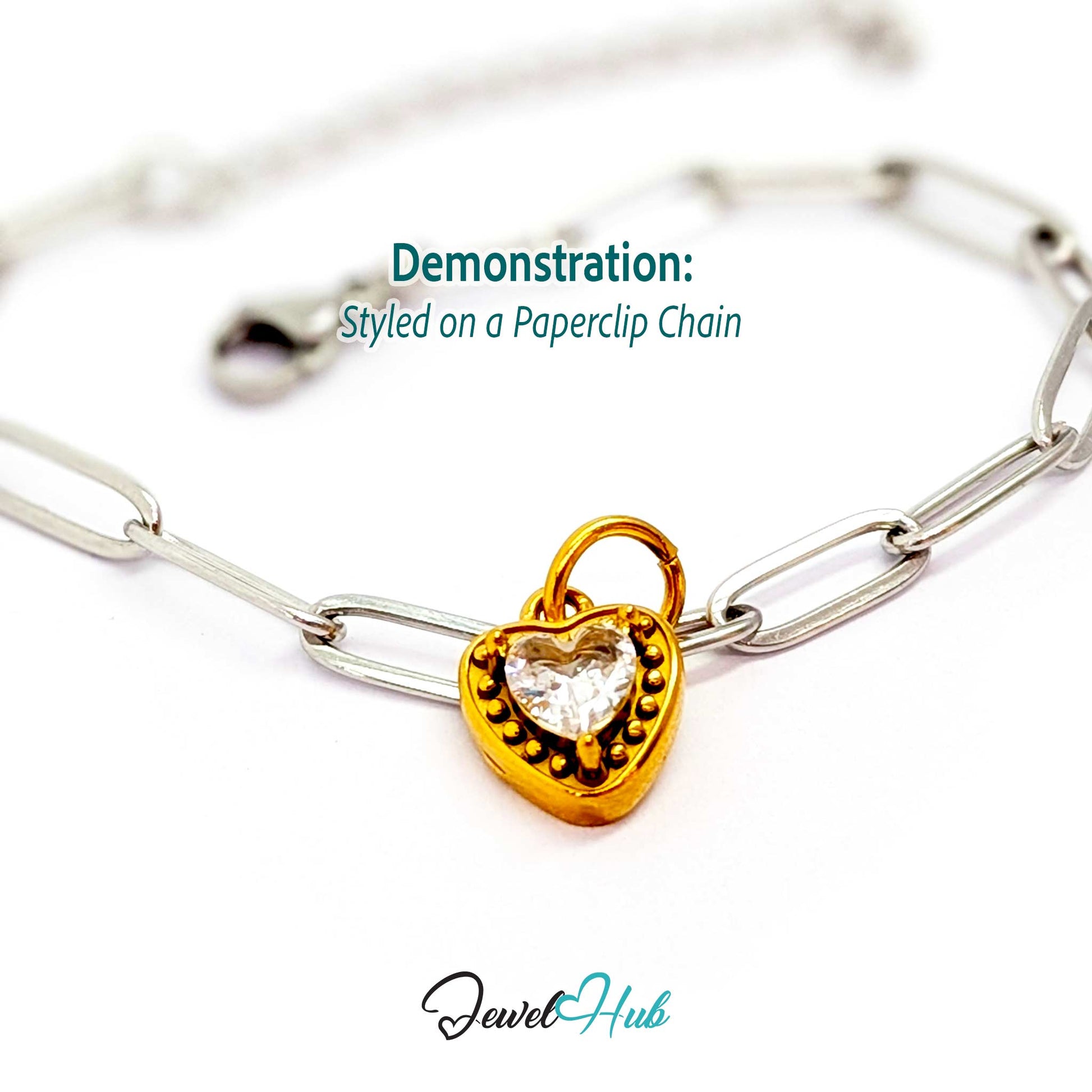 Gem Heart charm, gold stainless steel, styled on a silver paperclip chain bracelet - JewelHub