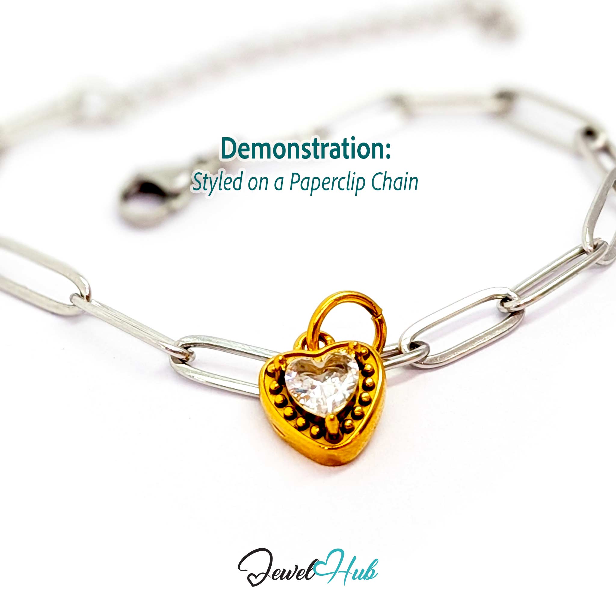 Gem Heart charm, gold stainless steel, styled on a silver paperclip chain bracelet - JewelHub