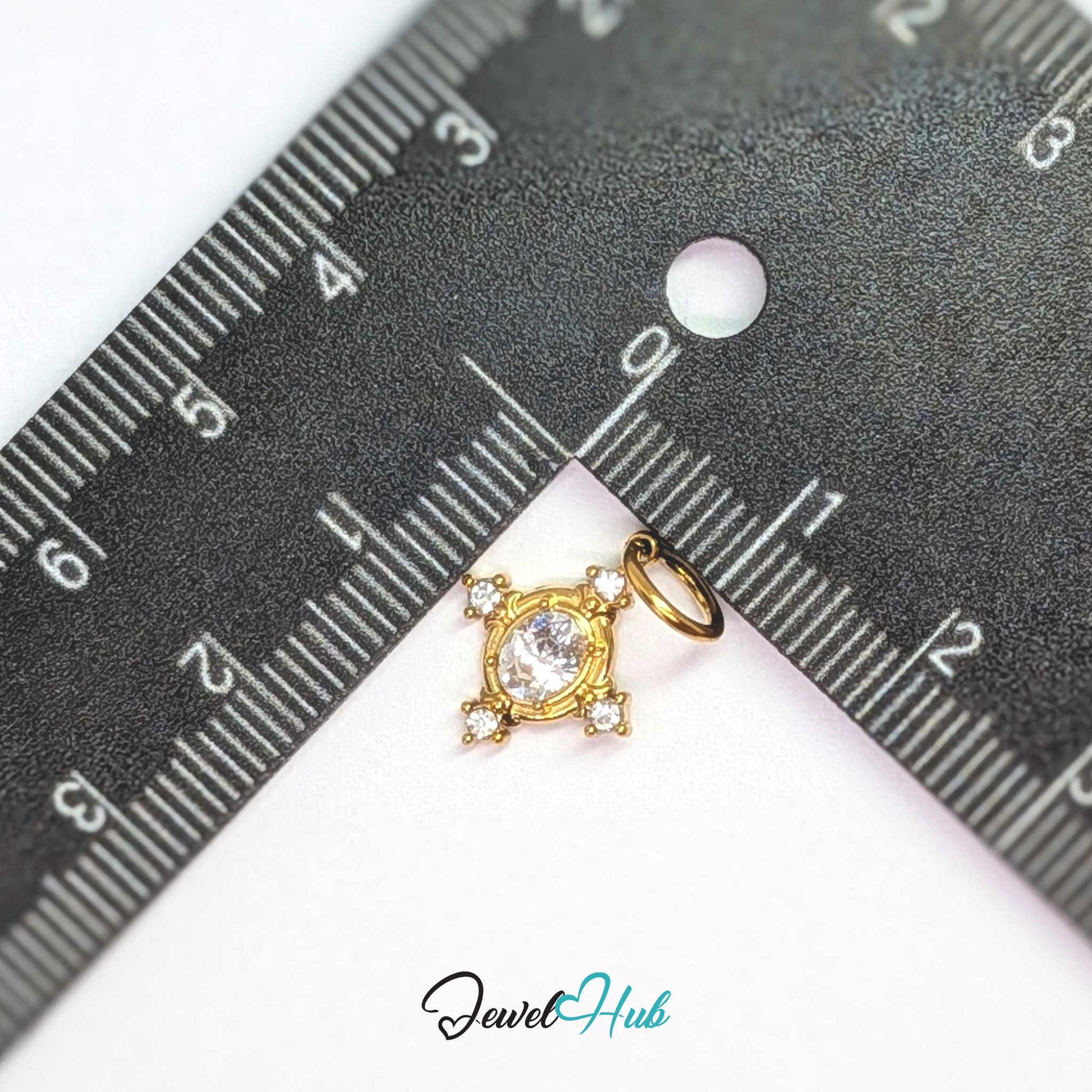 Gem Star charm, gold stainless steel, measured against a ruler at 12 x 15mm - JewelHub
