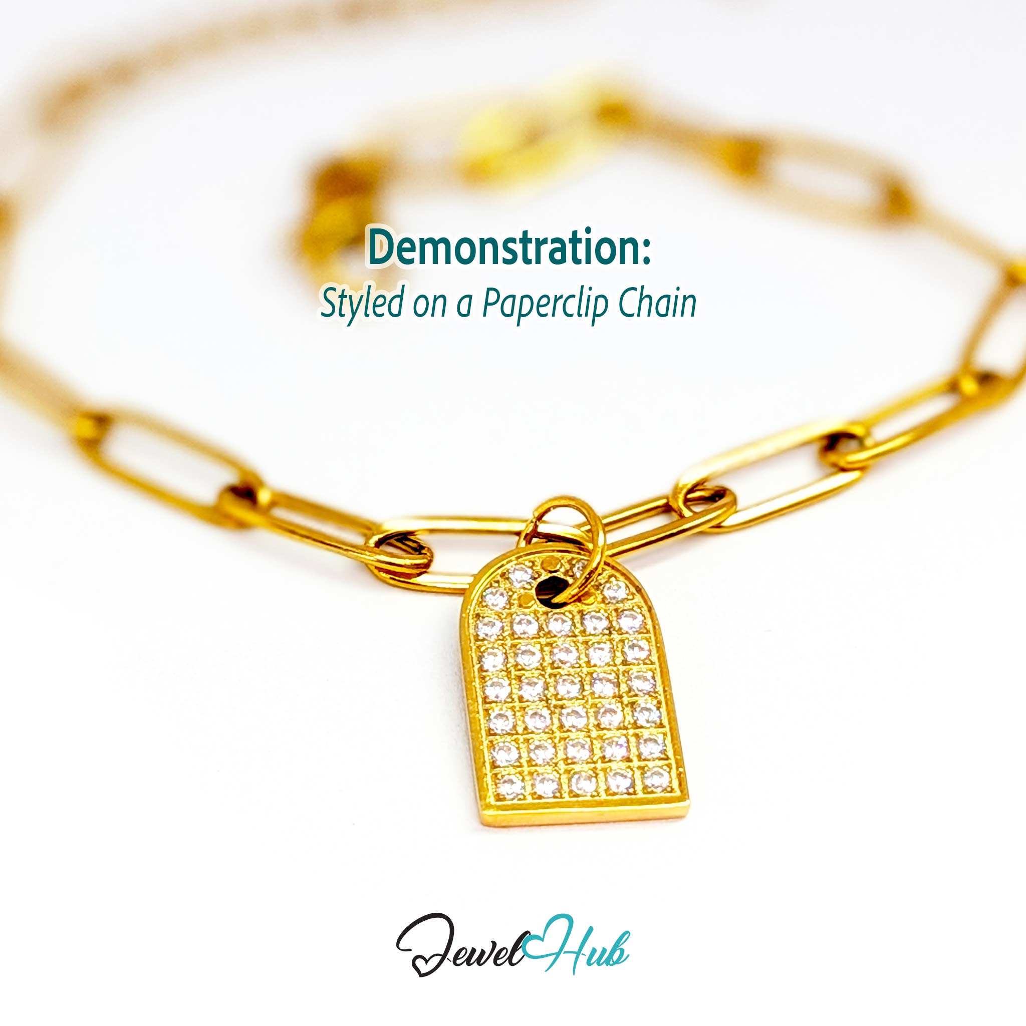 Pave Arch charm, gold stainless steel, styled on a gold paperclip chain bracelet - JewelHub