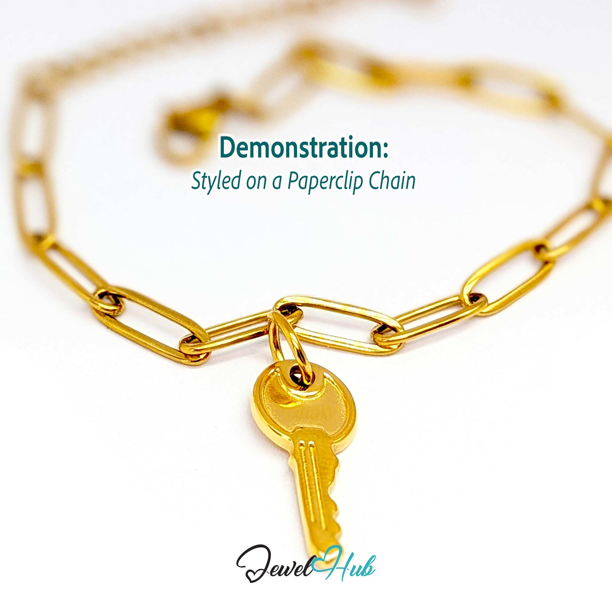 Everyday key charm in gold stainless steel with a plain round head - styled on a gold paperclip chain bracelet - JewelHub