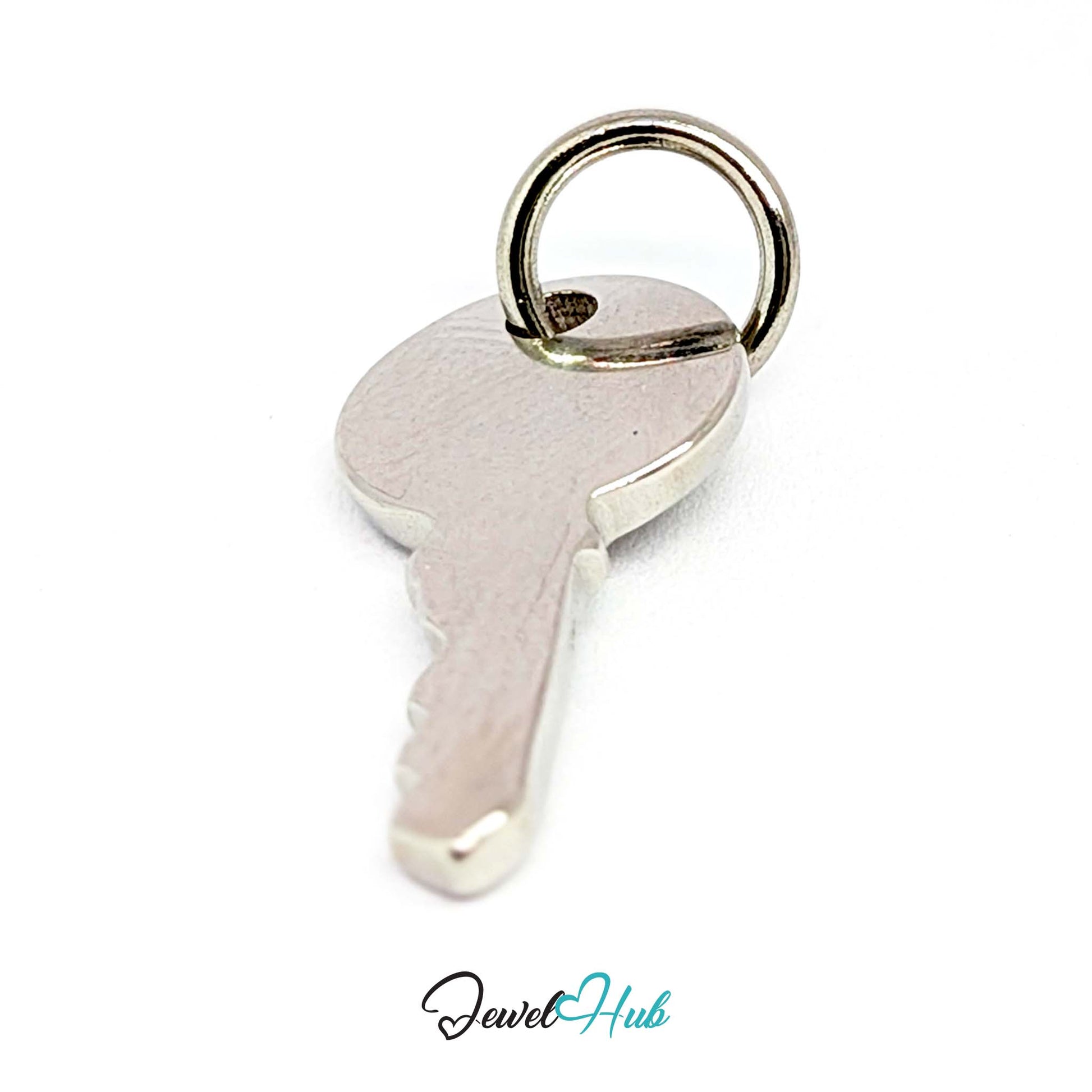 Everyday key charm in silver stainless steel with a plain round head - turned to show depth - JewelHub