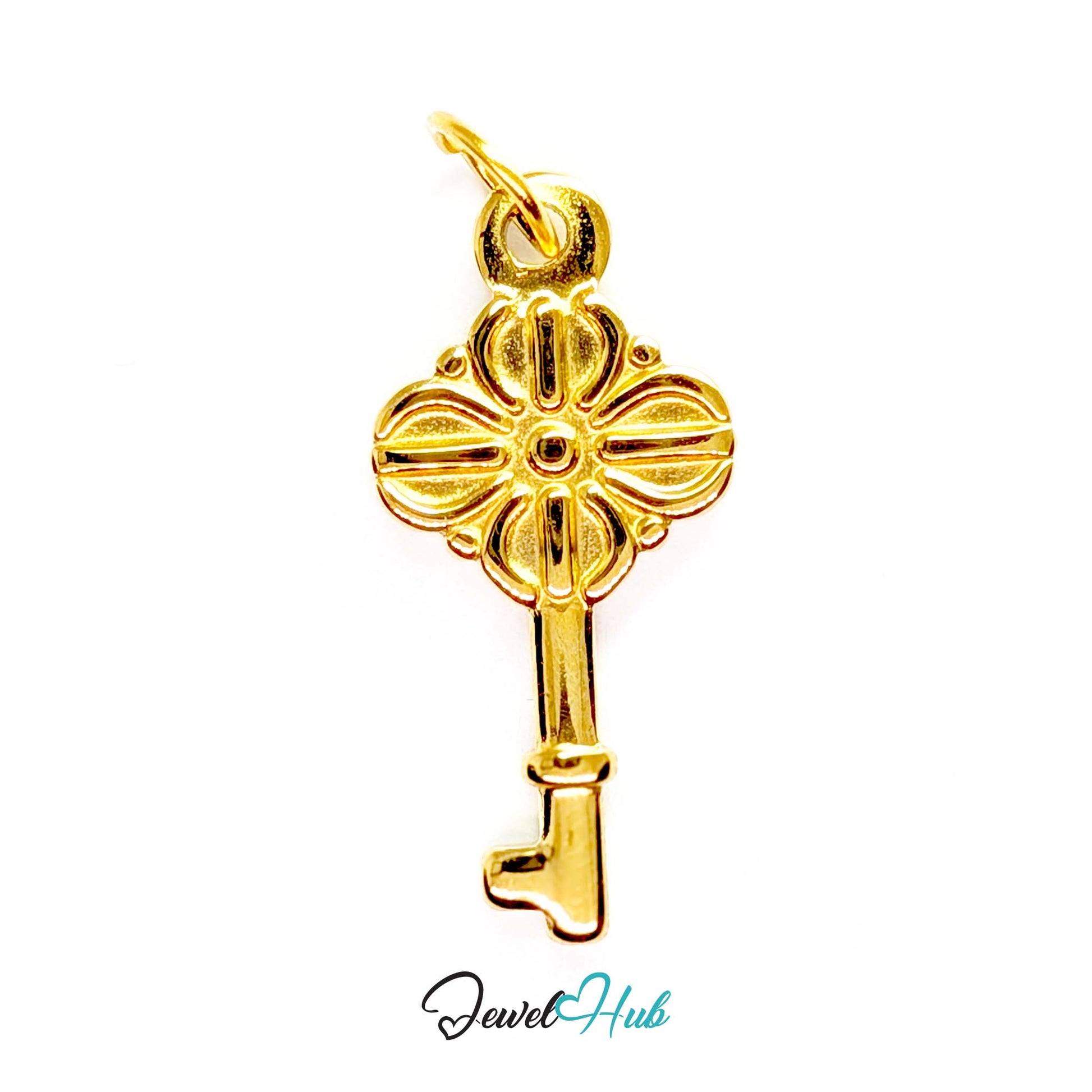 Vintage key charm in gold stainless steel with a quatrefoil bow - front view - JewelHub