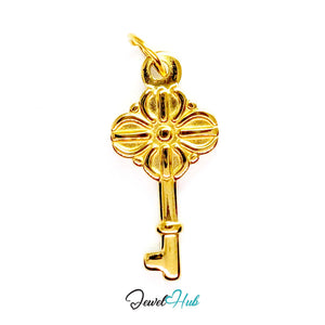 Vintage key charm in gold stainless steel with a quatrefoil bow - front view - JewelHub