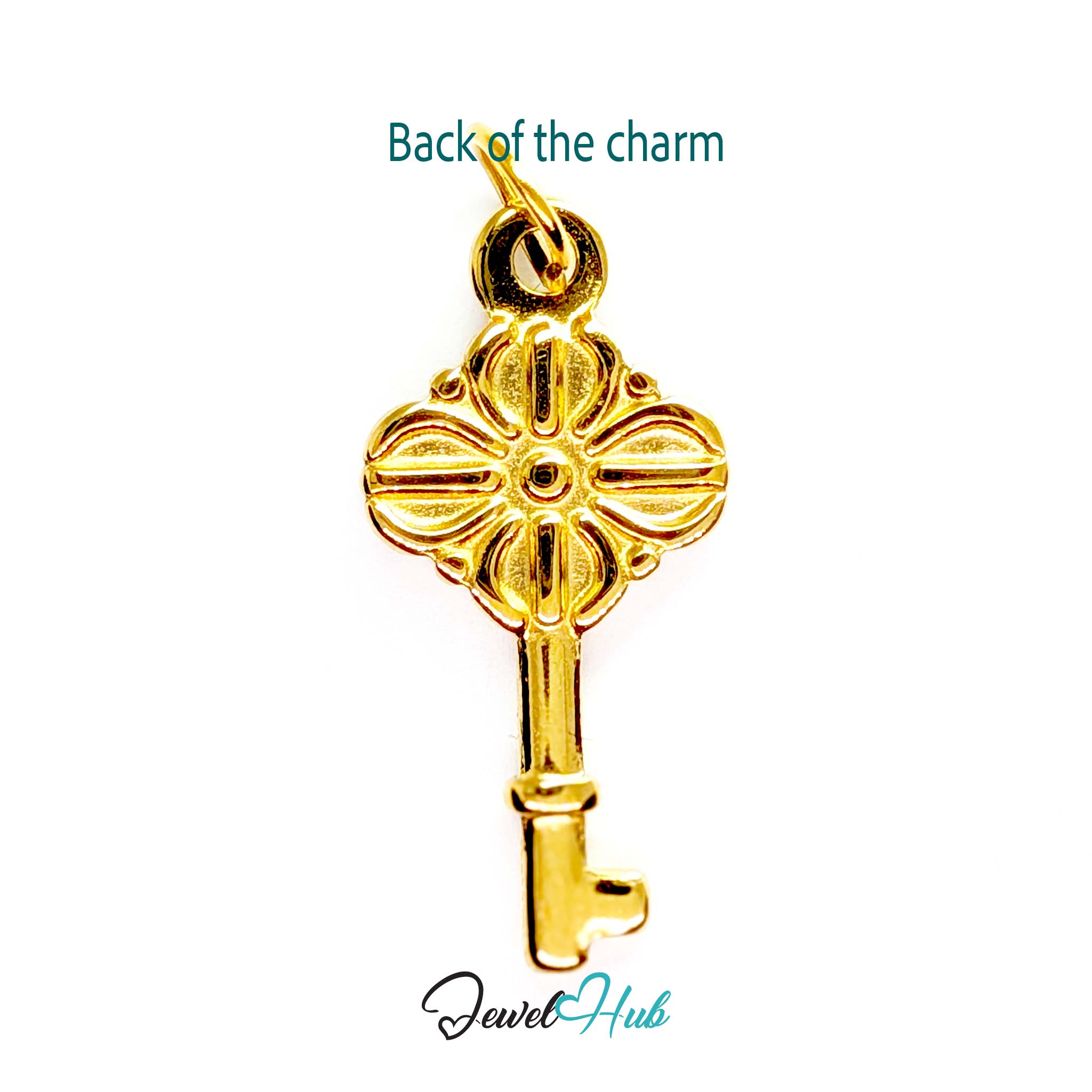 Vintage key charm in gold stainless steel with a quatrefoil bow - reverse - JewelHub