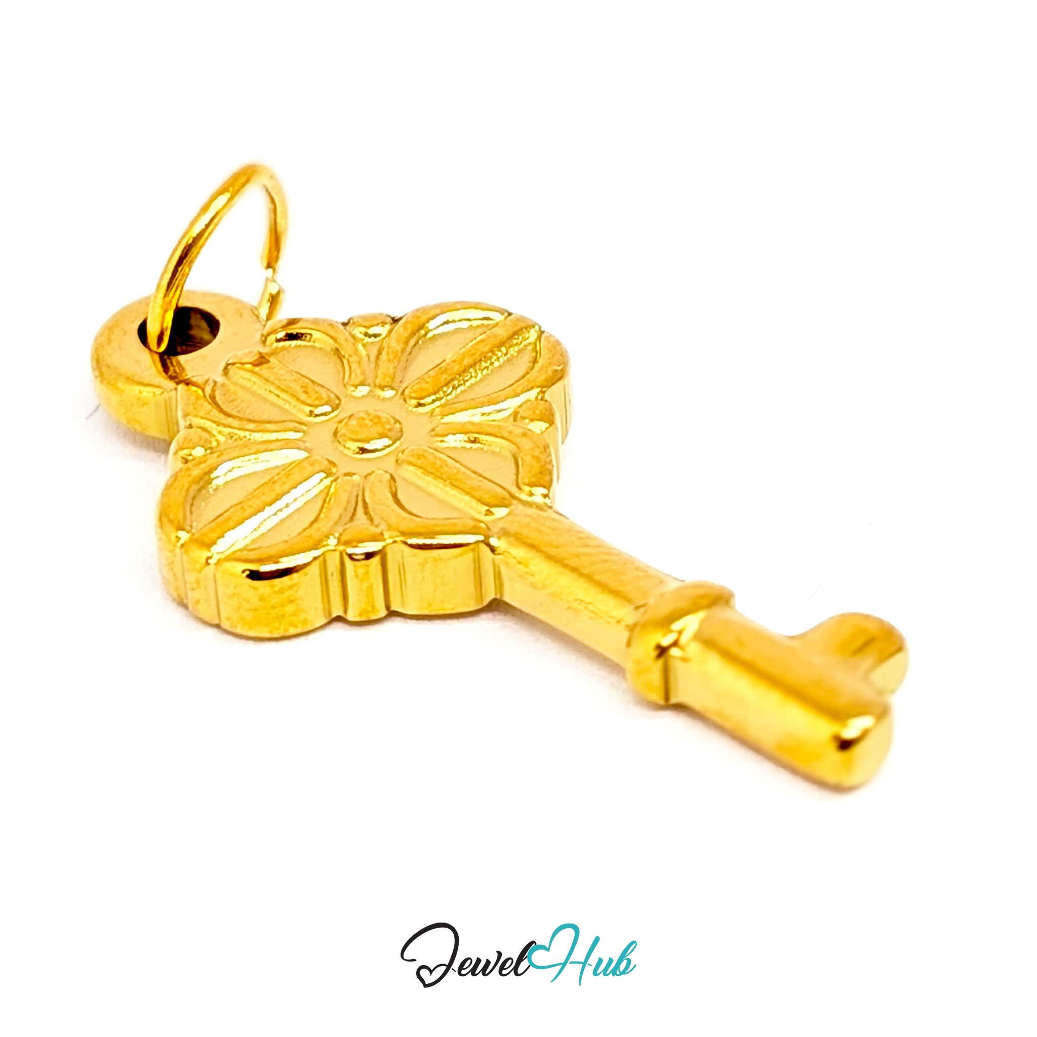Vintage key charm in gold stainless steel with a quatrefoil bow - three-quarter view - JewelHub
