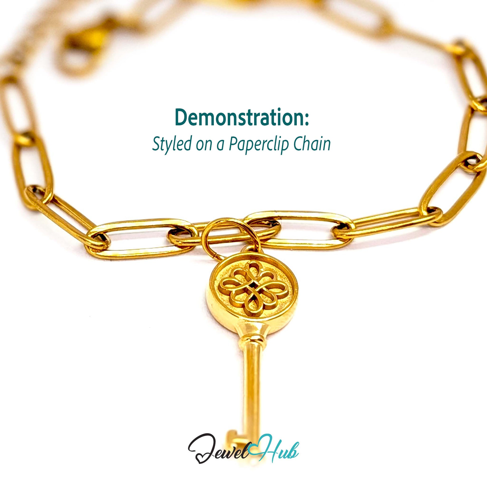 Round openwork key charm in gold stainless steel - styled on a gold paperclip chain bracelet - JewelHub