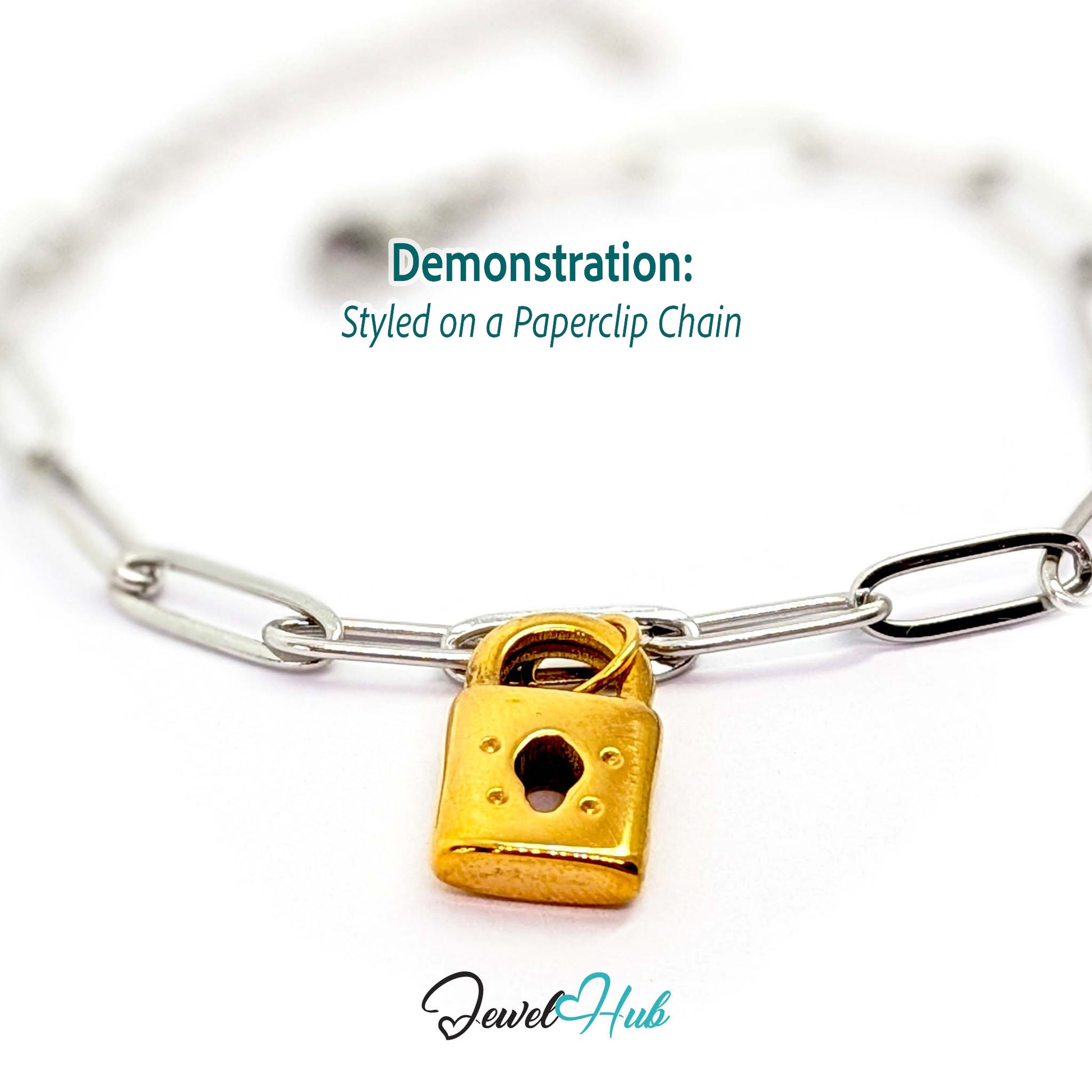 Classic padlock charm in gold stainless steel - styled on a silver paperclip chain bracelet - JewelHub