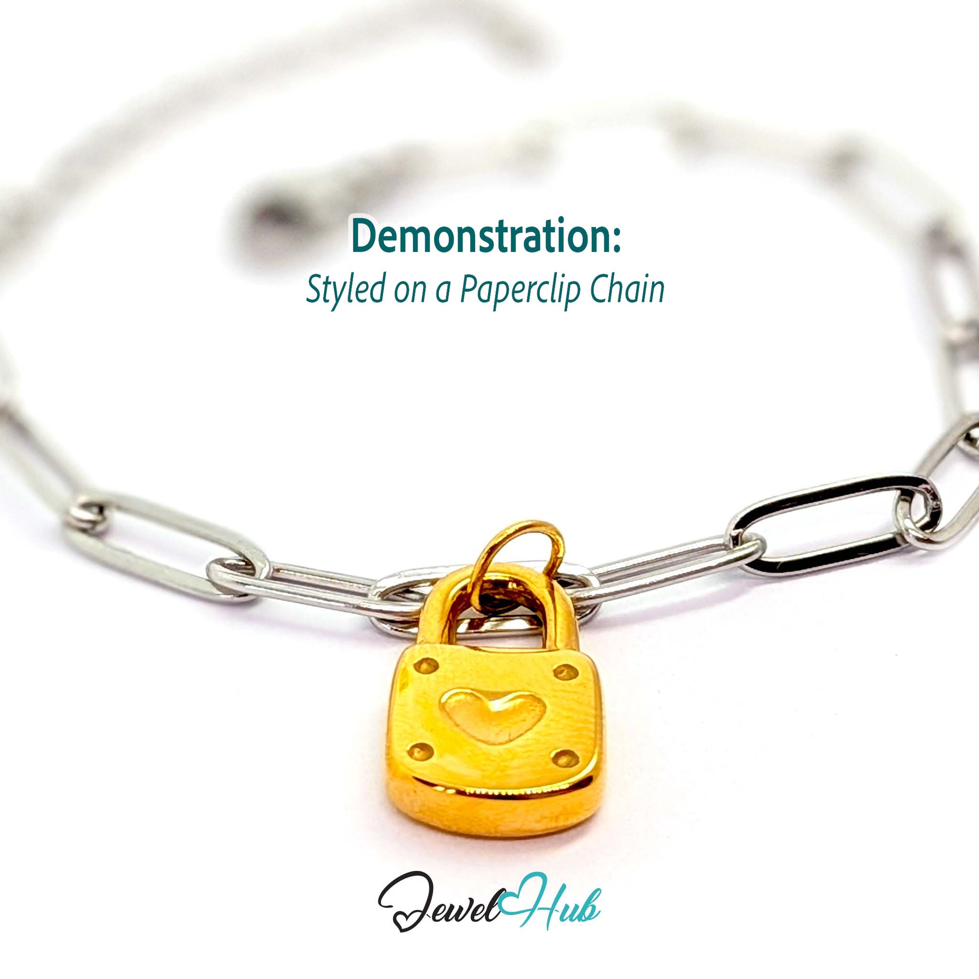 Heart padlock charm in gold stainless steel - styled on a silver paperclip chain bracelet - JewelHub