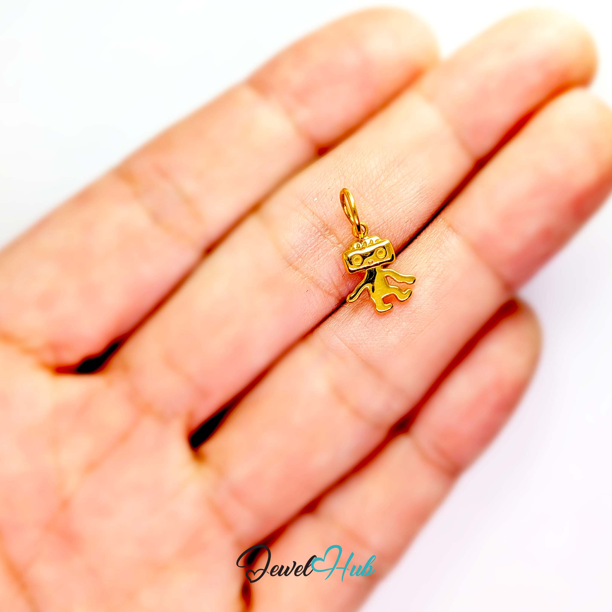 Mini TV robot charm in gold stainless steel - held in the hand for scale - JewelHub