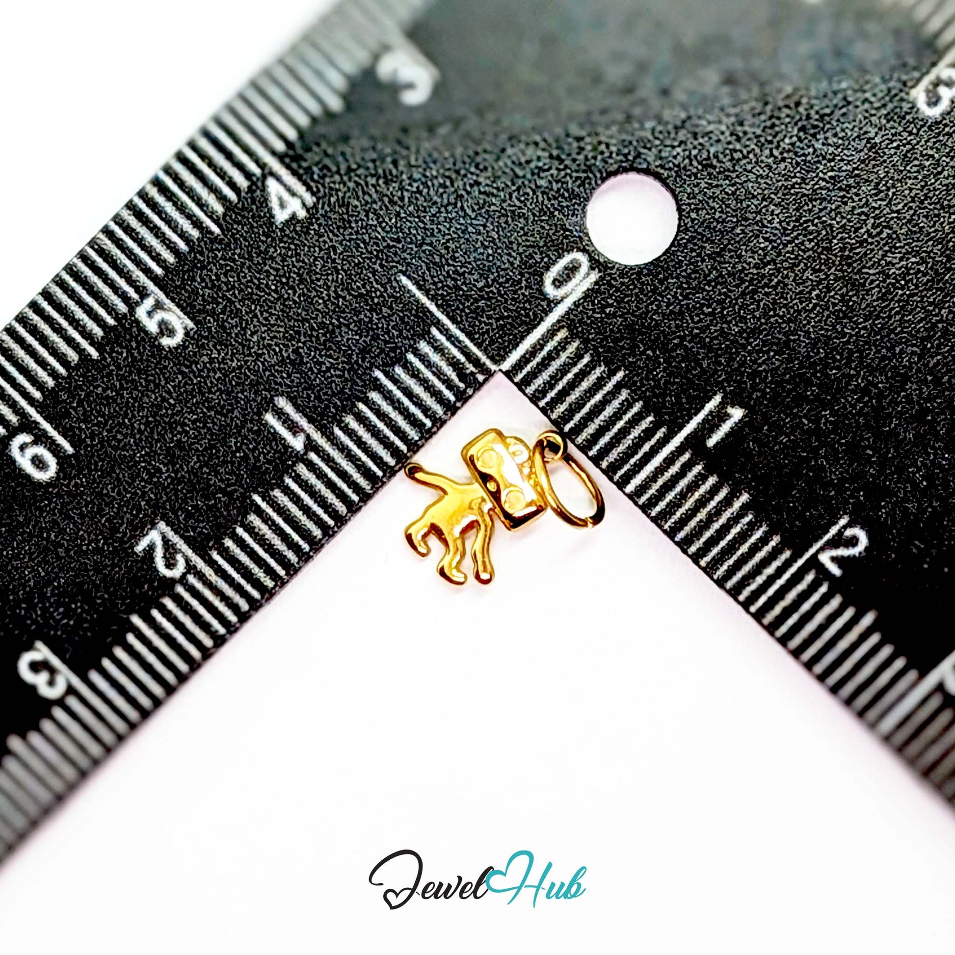 Mini TV robot charm in gold stainless steel - beside a ruler for scale - JewelHub