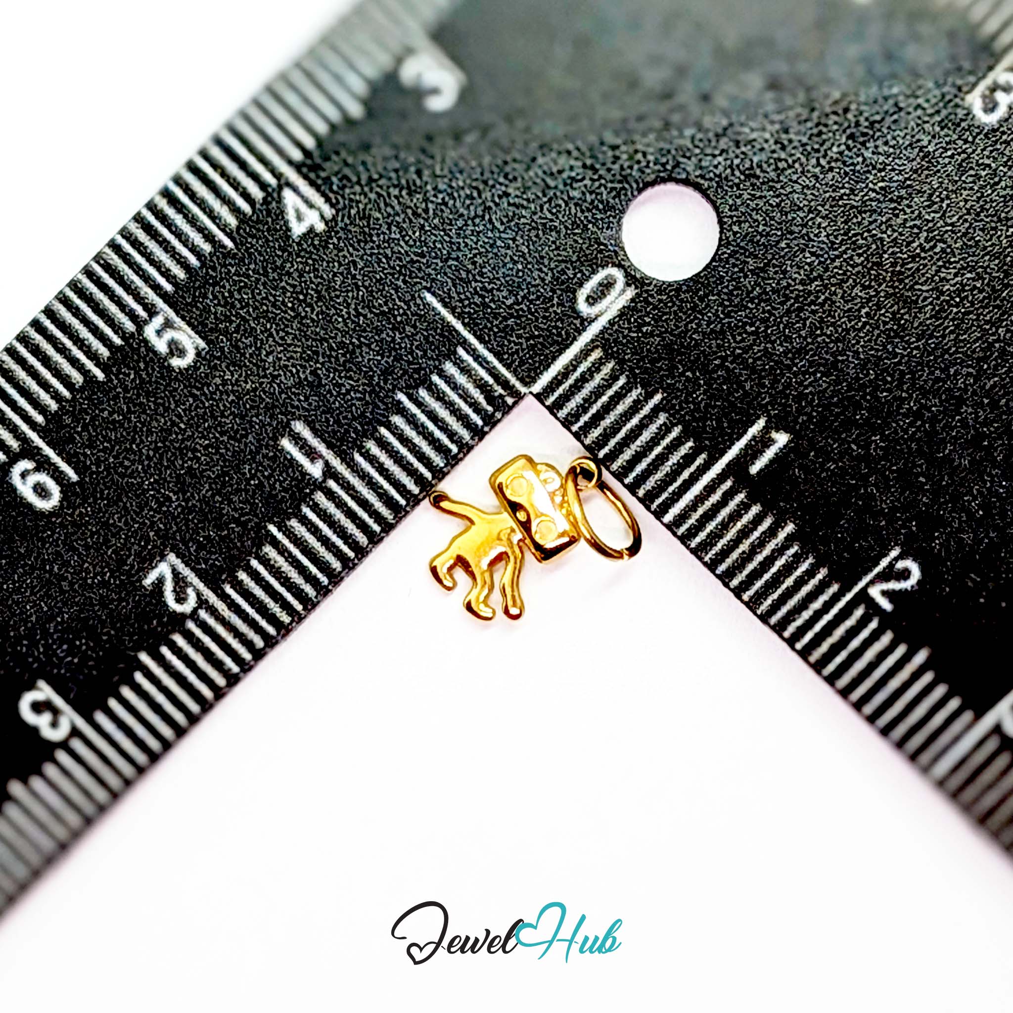 Mini TV robot charm in gold stainless steel - beside a ruler for scale - JewelHub
