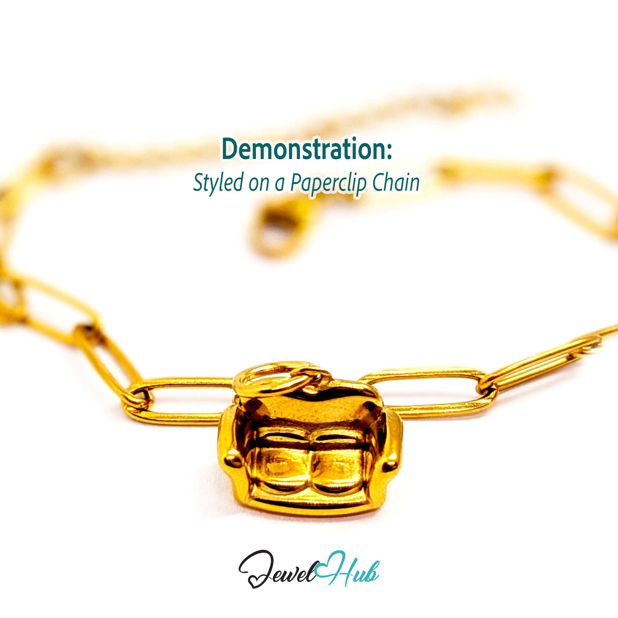 Three-dimensional sofa charm in gold stainless steel - styled on a gold paperclip chain bracelet - JewelHub